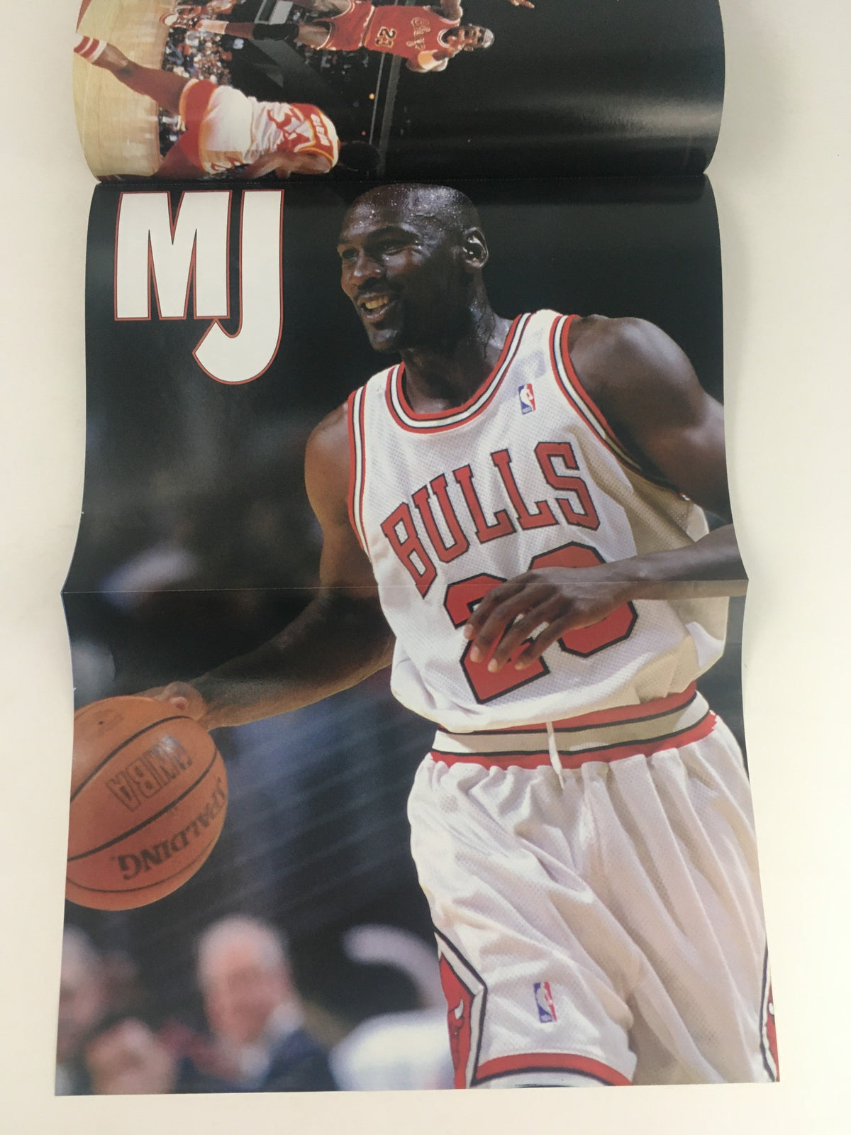 Gold Basketball Magazine 1998 including a poster of Michael Jordan #23, displaying MJ smiling while dribbling a basketball, ideal for fans of basketball history and memorabilia collectors.