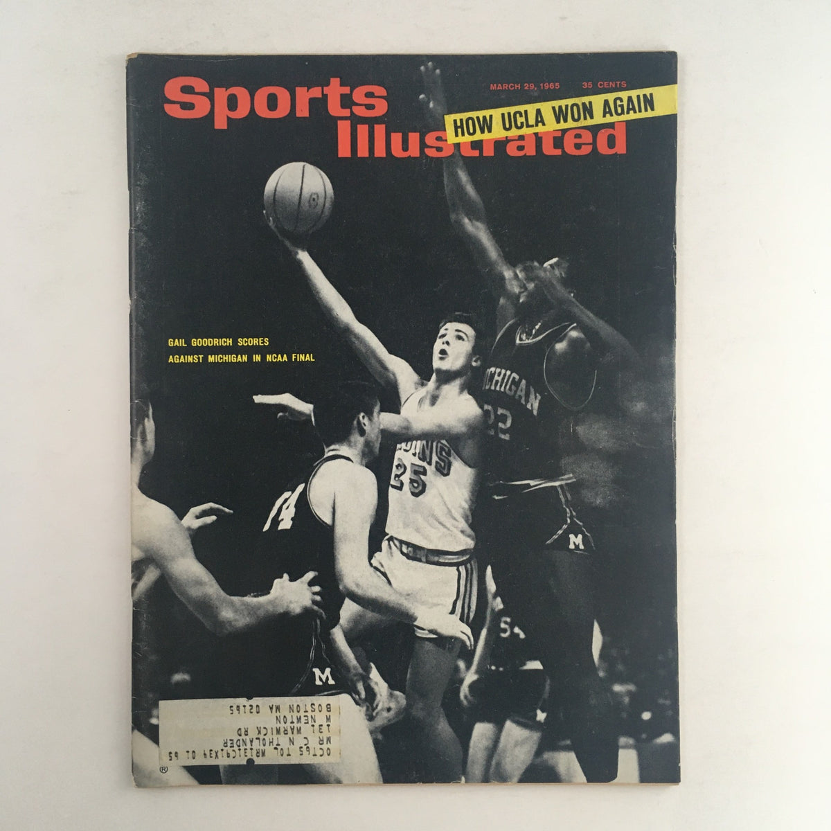 Sports Illustrated Magazine dated March 29, 1965 featuring Gail Goodrich scoring against Michigan in the NCAA final. Vintage collectible magazine with minor wear, address label on front, depicting a historic basketball moment.