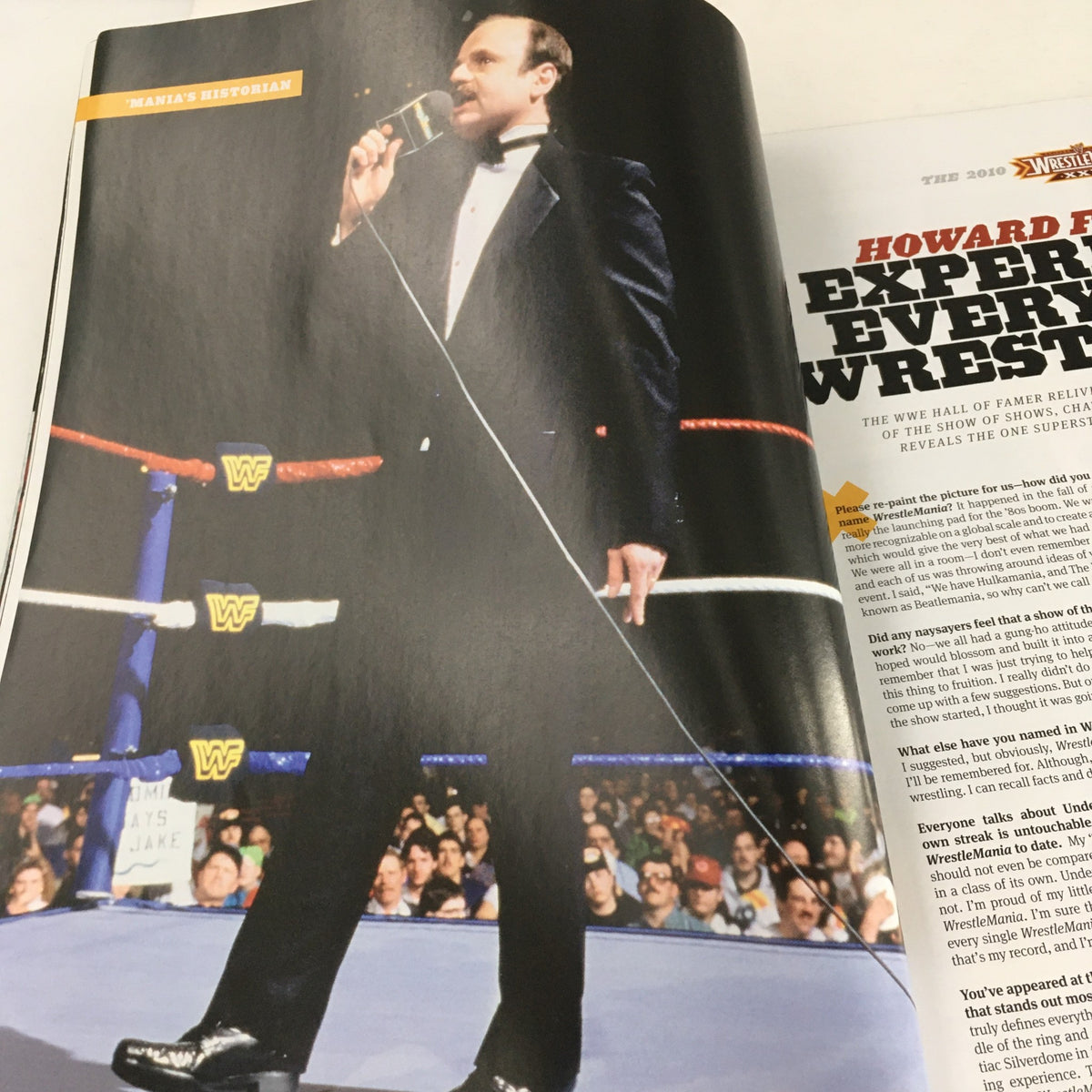 Image of Howard Finkel in WWF Magazine 2010, showcasing the contributions of wrestling announcers and experts in the context of Wrestle Mania XXVI Almanac.