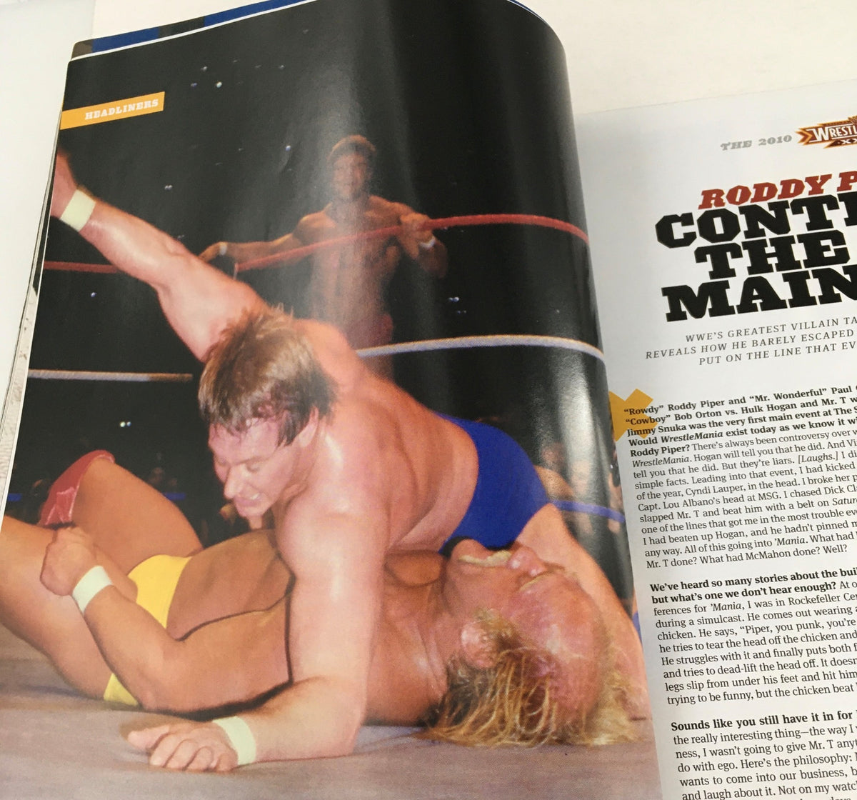 WWF Magazine 2010 Wrestle Mania XXVI Almanac showcasing a wrestling match with Roddy Piper in action during a classic bout.