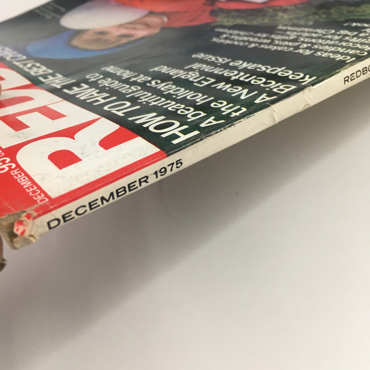 Side view of Redbook Magazine December 1975 showing the spine with the publication date and title prominently displayed.