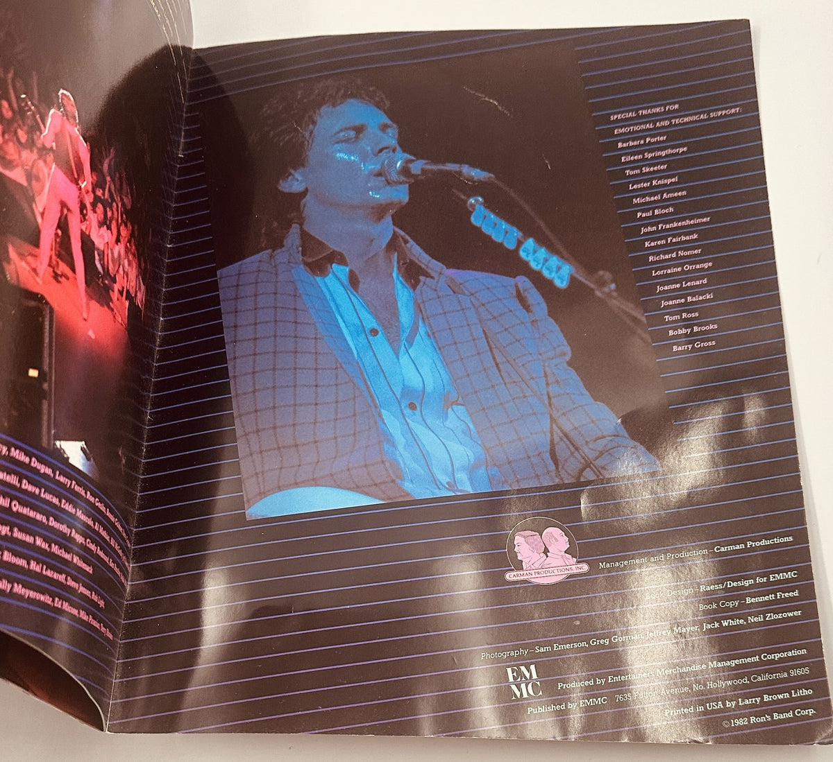 Back page of the Rick Springfield Magazine 1982 Sweat For Success Tour program featuring production credits and a photo of Rick Springfield at the microphone, reflecting the concert atmosphere.