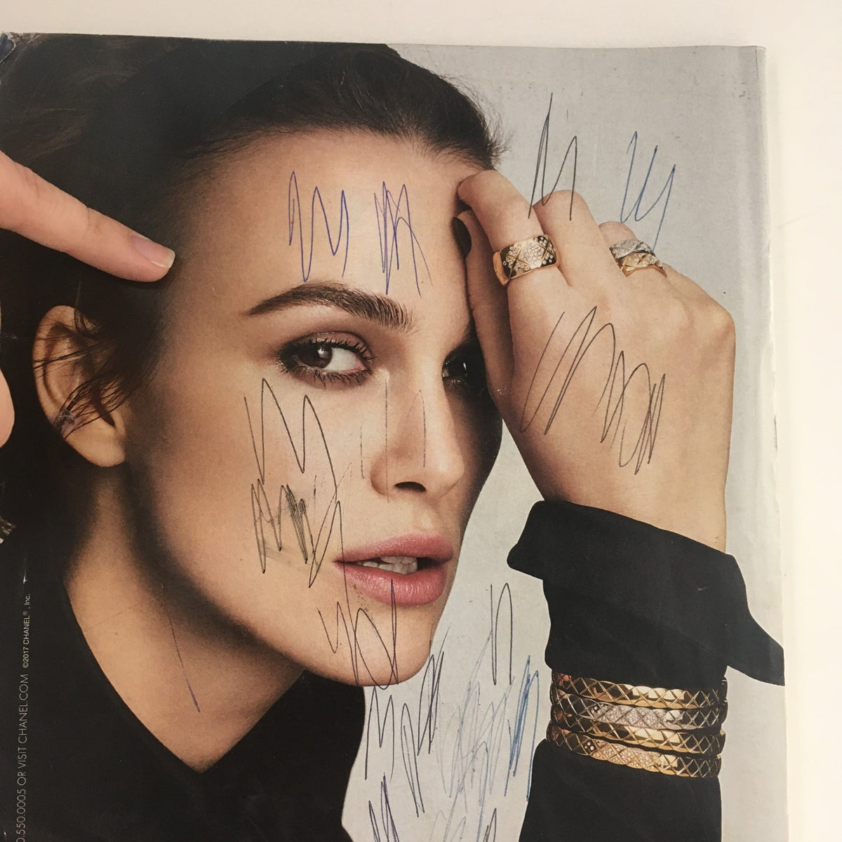 Altered close-up of a model from Vanity Fair Magazine April 2017, emphasizing Chanel jewelry, marked with scribbles and imperfections.