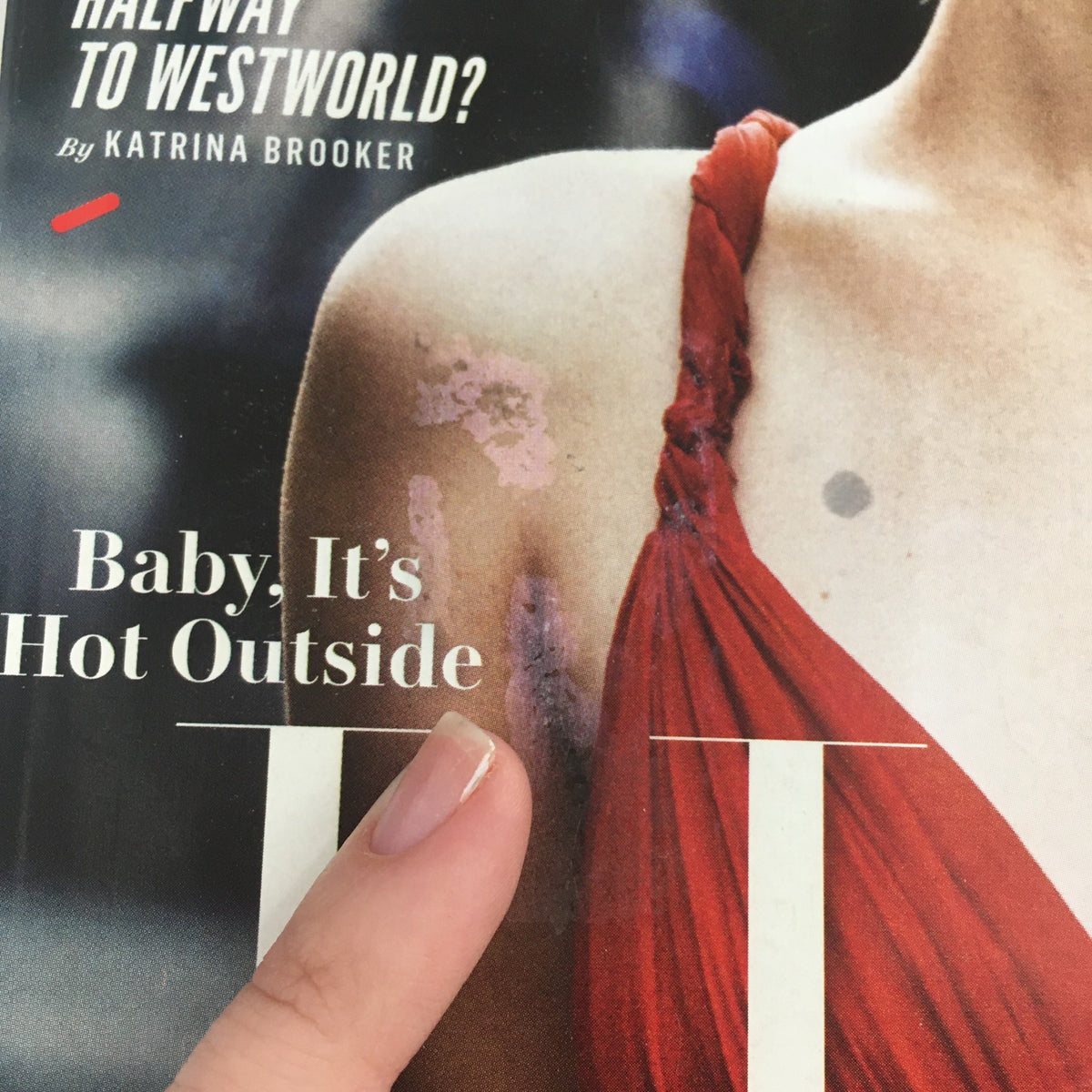 Close-up detail of the Vanity Fair Magazine Holiday 2016 featuring Jennifer Lawrence, showing minor imperfections on the cover, reflecting its good condition despite wear and tear. The cover includes the phrase 'Baby, It's Hot Outside.'