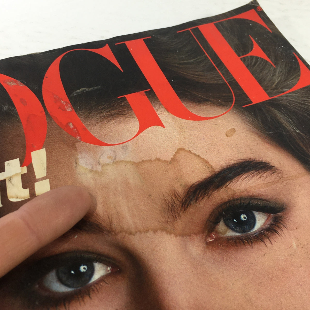 Close-up view of Vintage Vogue Magazine May 1981 cover, highlighting wear and tear, featuring Brooke Shields and iconic red lettering.