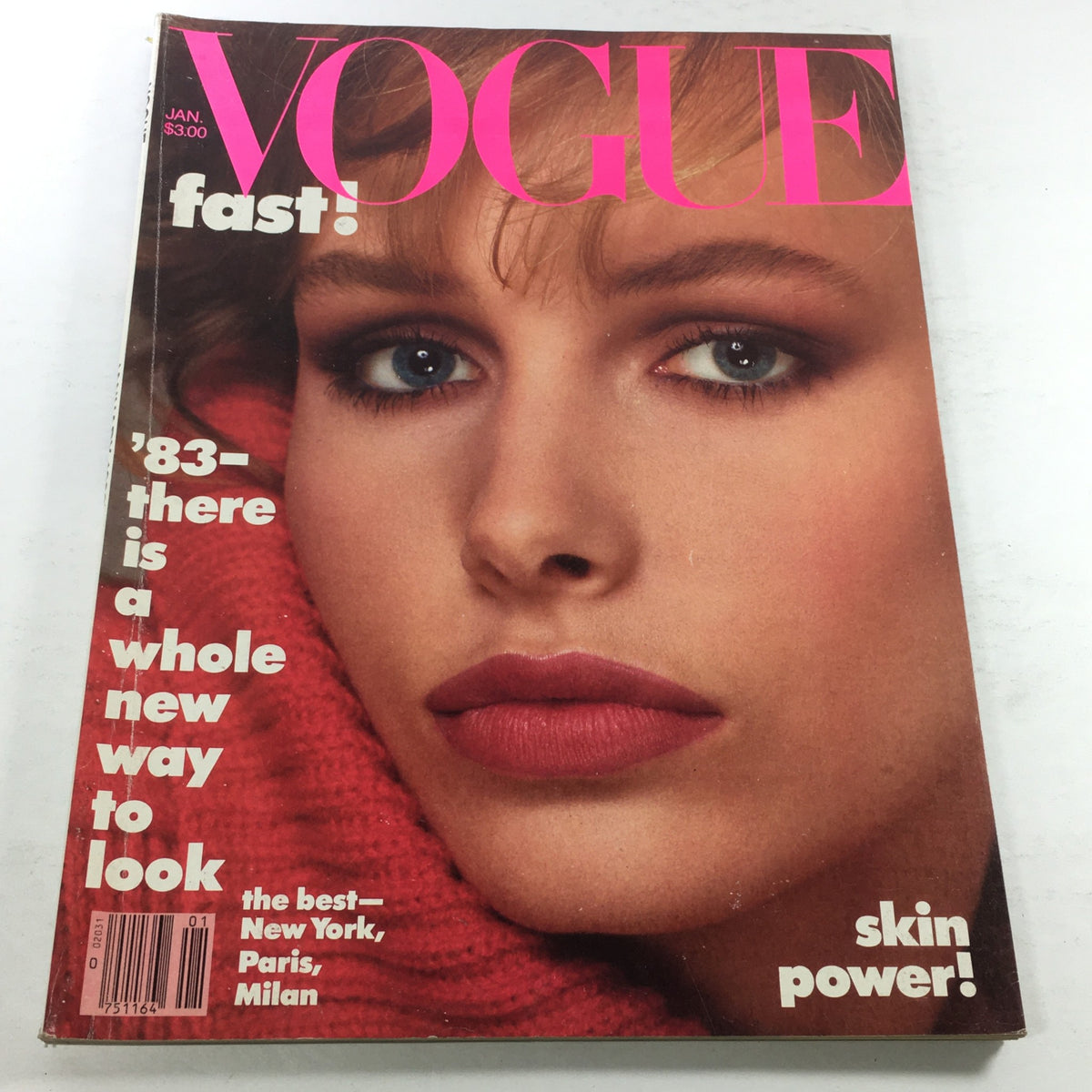 VTG Vogue Magazine: January 1983 featuring a close-up of model Lauren Helm's face on the front cover, showcasing iconic 80s fashion and makeup style.