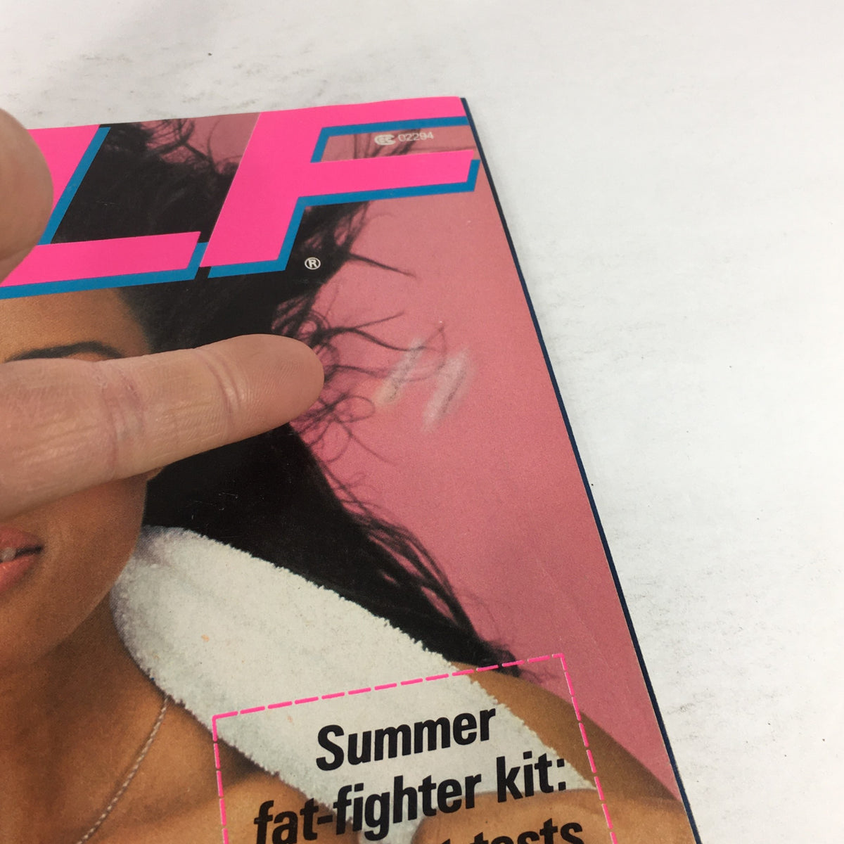 Close-up view of the cover of VTG Self Magazine June 1982, pointing at imperfections. The text remains clear, emphasizing 'Summer fat-fighter kit' and the magazine's special focus on health and beauty.