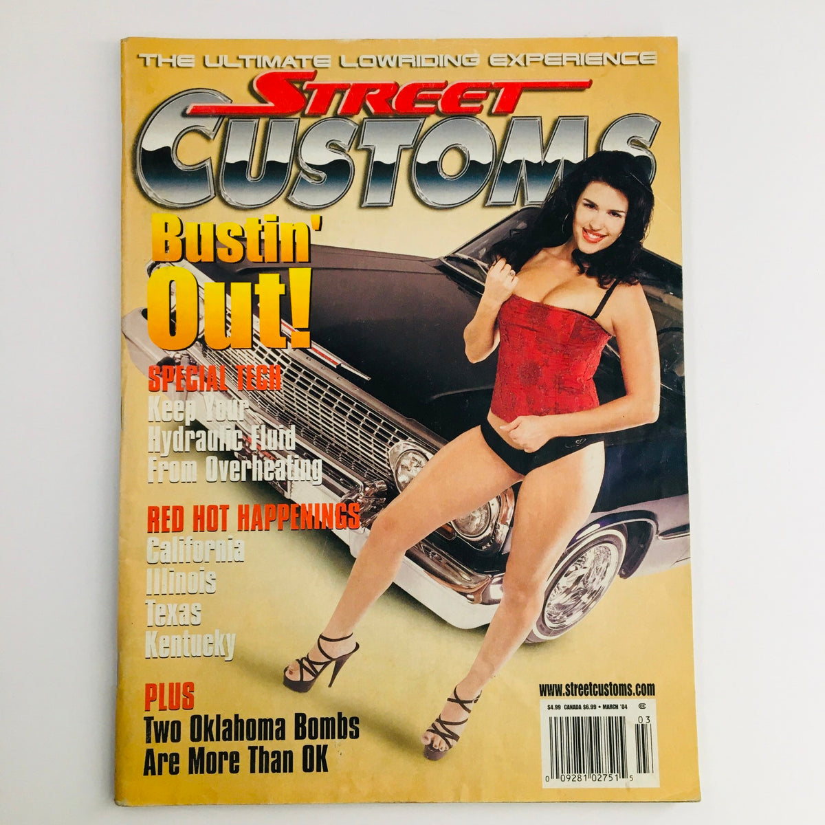 Cover of Street Customs Magazine March 2004 featuring a model in a red outfit and a custom car, highlighting the theme 'Two Oklahoma Bombs Are More Than OK'.