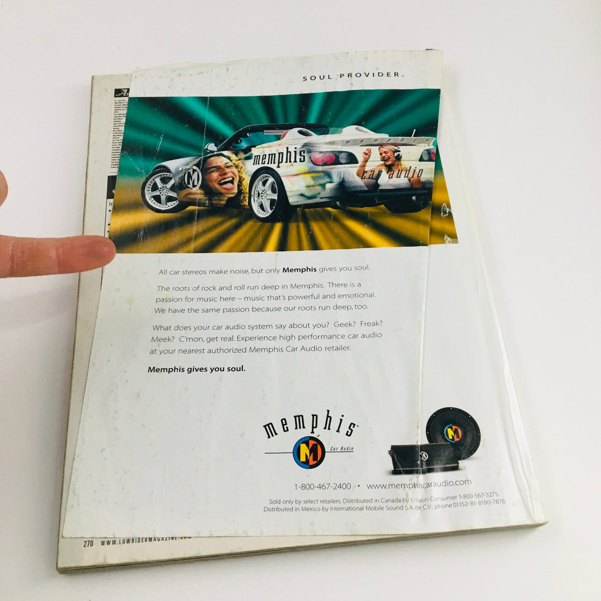 Back cover of the LowRider Magazine May 2003 featuring an advertisement for Memphis Car Audio and a lowrider theme.
