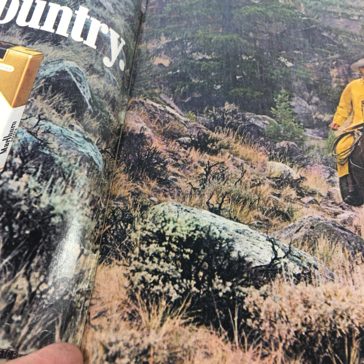 Interior view of vintage Esquire Magazine from May 9, 1978, showcasing an outdoor scene with a hiker in a yellow rain slicker, capturing the essence of adventure and nature.