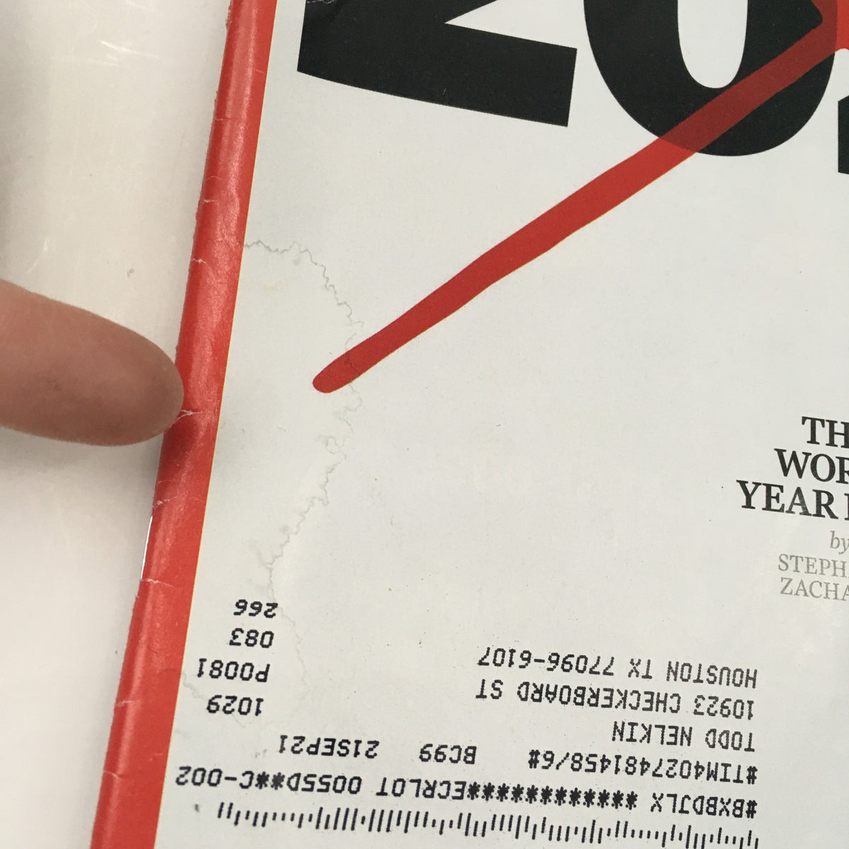 Cover of Time Magazine December 14, 2020, titled 'The Worst Year Ever' by Stephanie Zacharek, showing significant wear and an address label.
