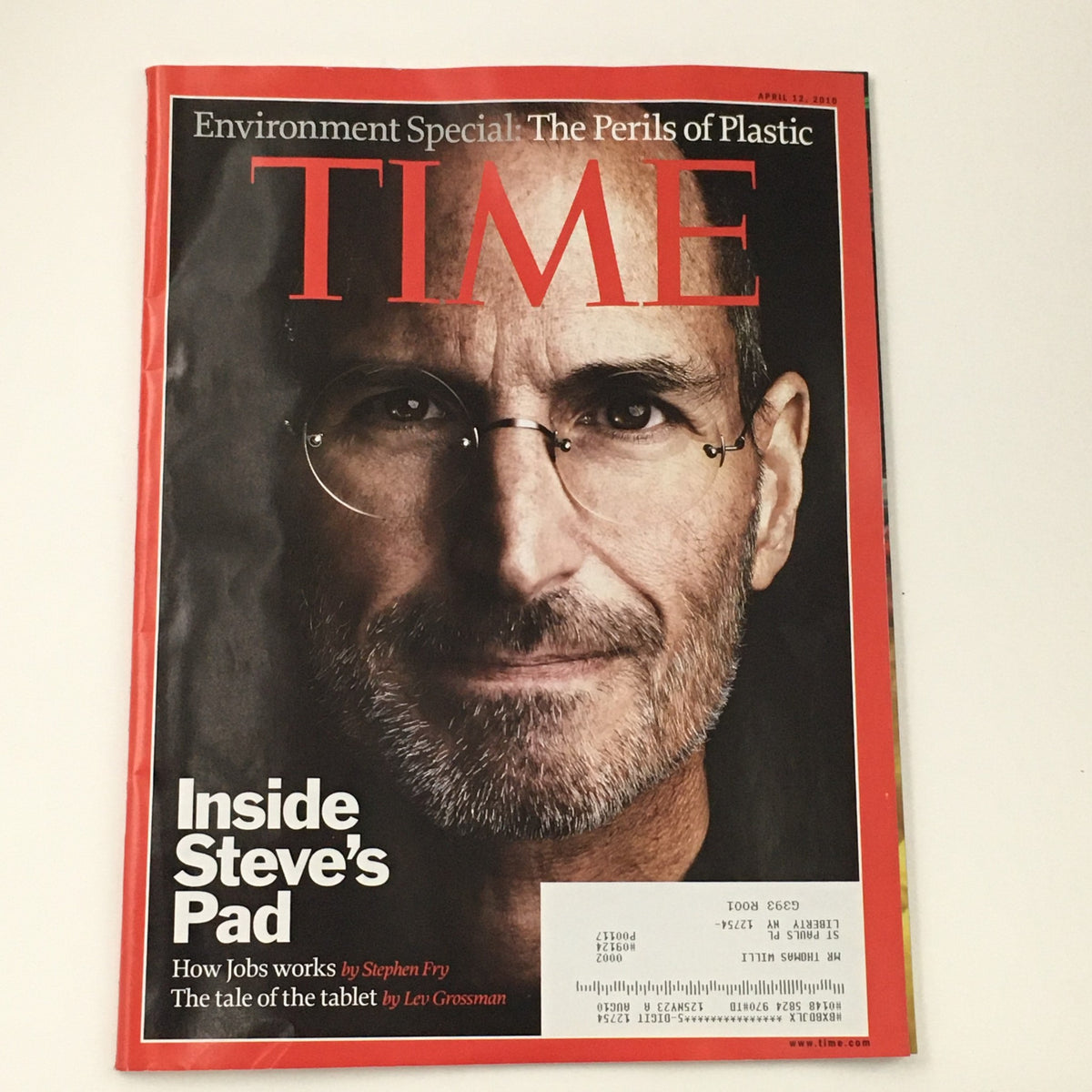Cover of Time Magazine April 12 2010 featuring Steve Jobs, titled 'Inside Steve's Pad & The Perils of Plastic'. The cover showcases a close-up image of Steve Jobs with glasses, highlighting the magazine's focus on his life and innovative contributions.