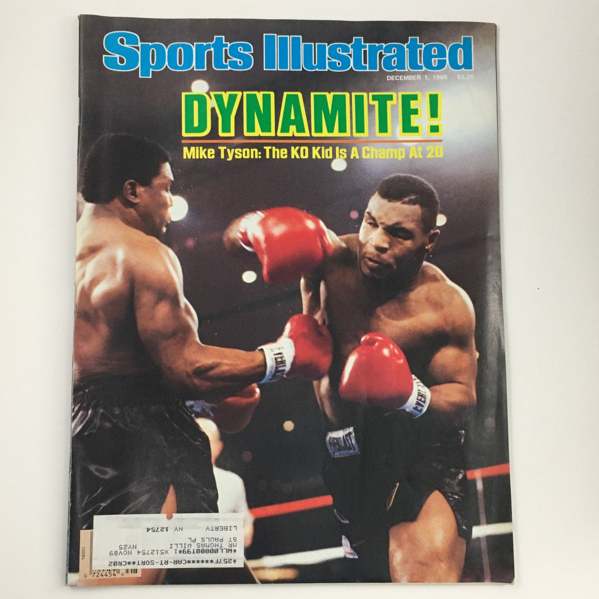 Sports Illustrated Magazine cover from December 1, 1986 featuring Dynamite Mike Tyson, titled 'Mike Tyson: The KO Kid is a Champ at 20', showcasing a boxing scene with Tyson in red gloves.