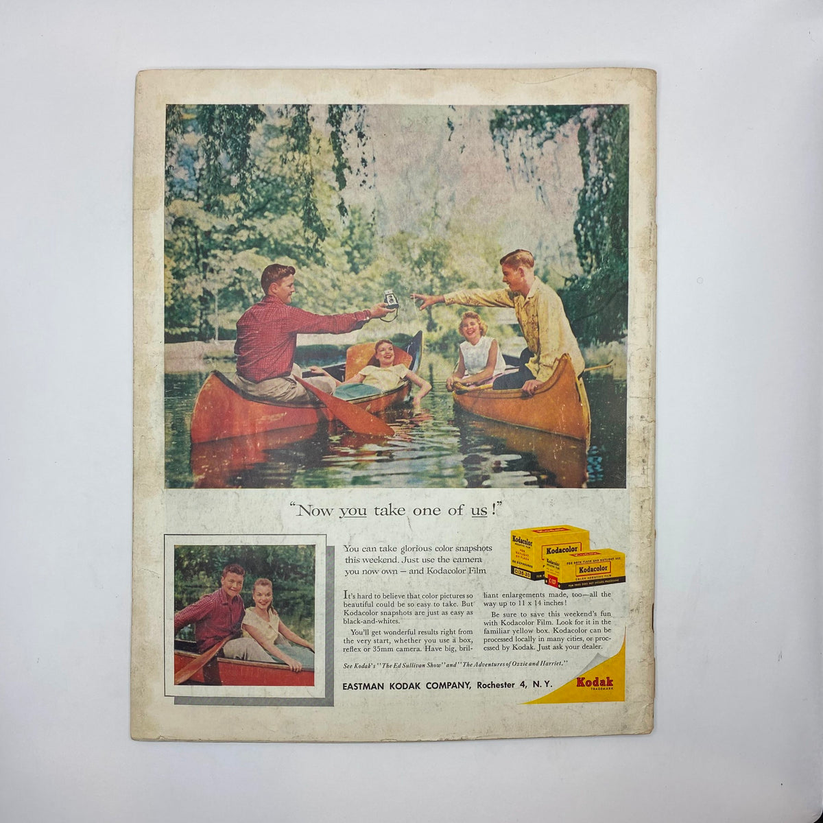 Back cover of Saturday Evening Post Magazine from July 26, 1958 showcasing an advertisement for Kodak film with an image of people enjoying a summer day canoeing.