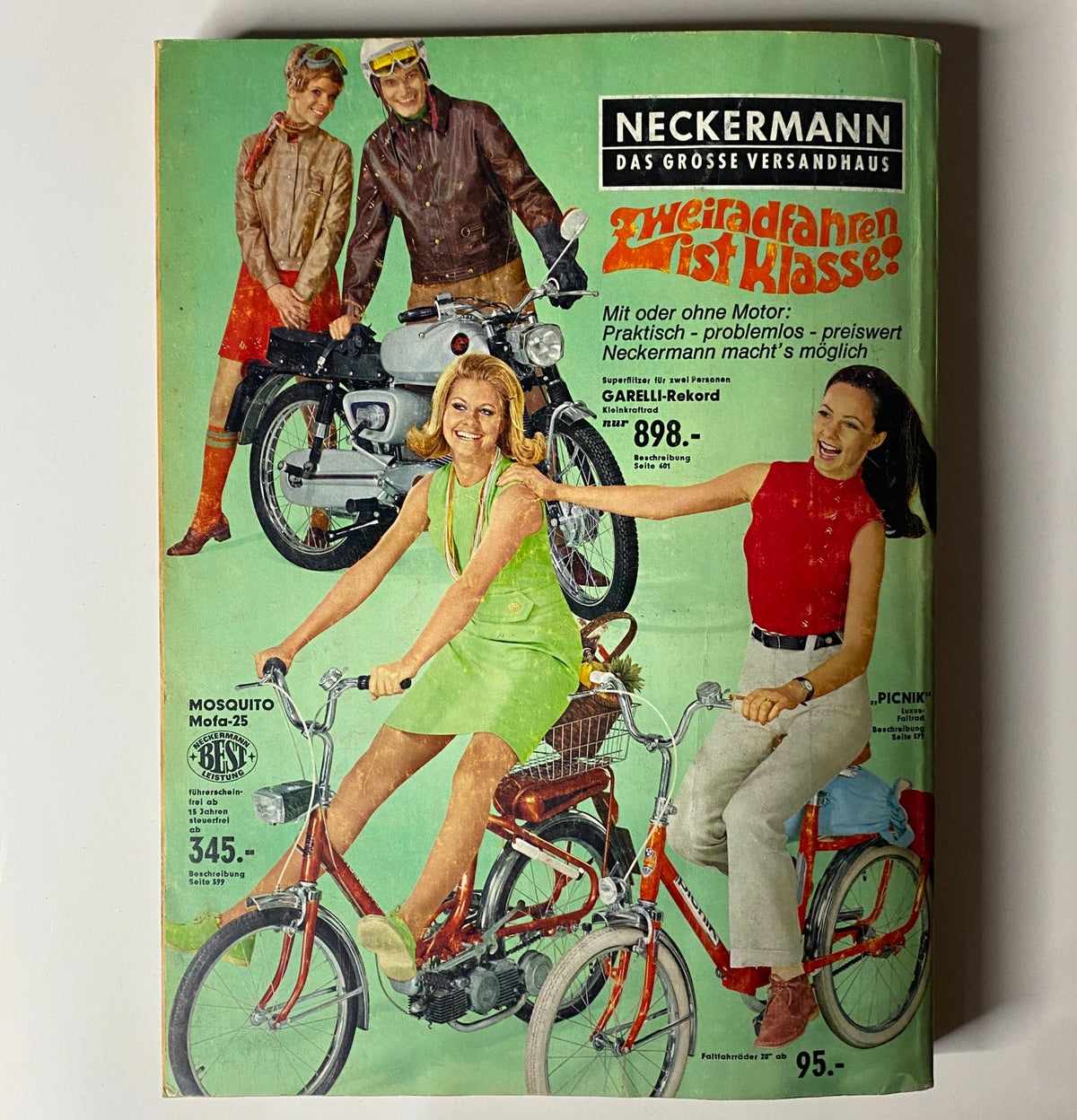 Cover image of the 1969 Neckermann Sommer Catalog featuring stylish models on bicycles, emphasizing retro fashion and products available.