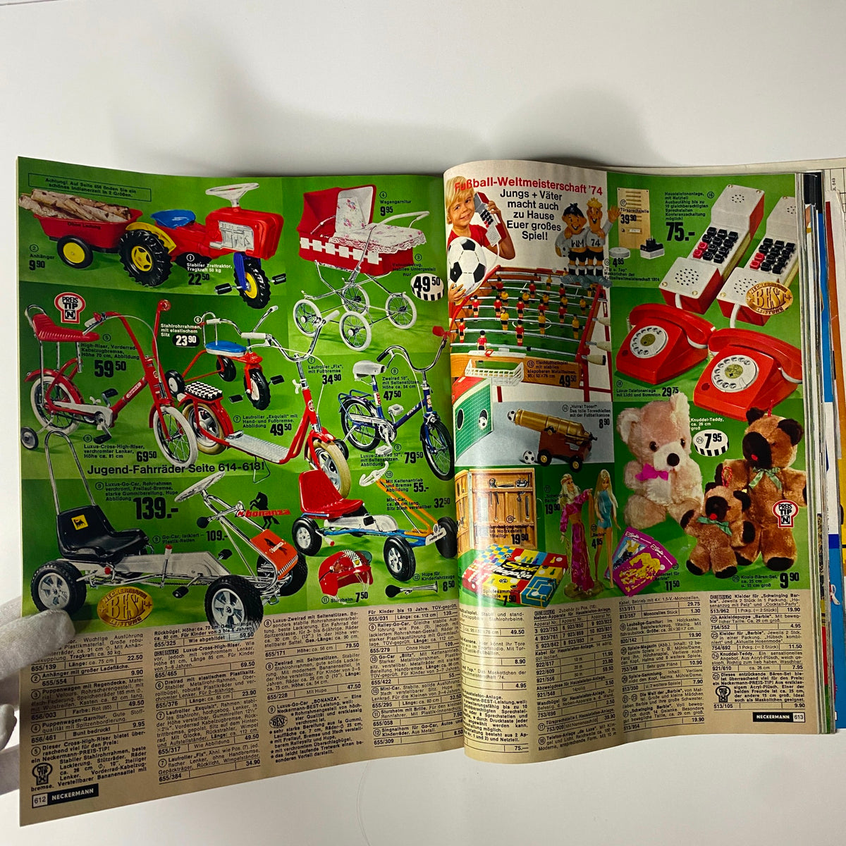 1974 Neckermann Sommer Catalog showing a colorful spread of children's toys including tricycles, ride-on cars, and board games, highlighting vintage mid-1970s German consumer culture.