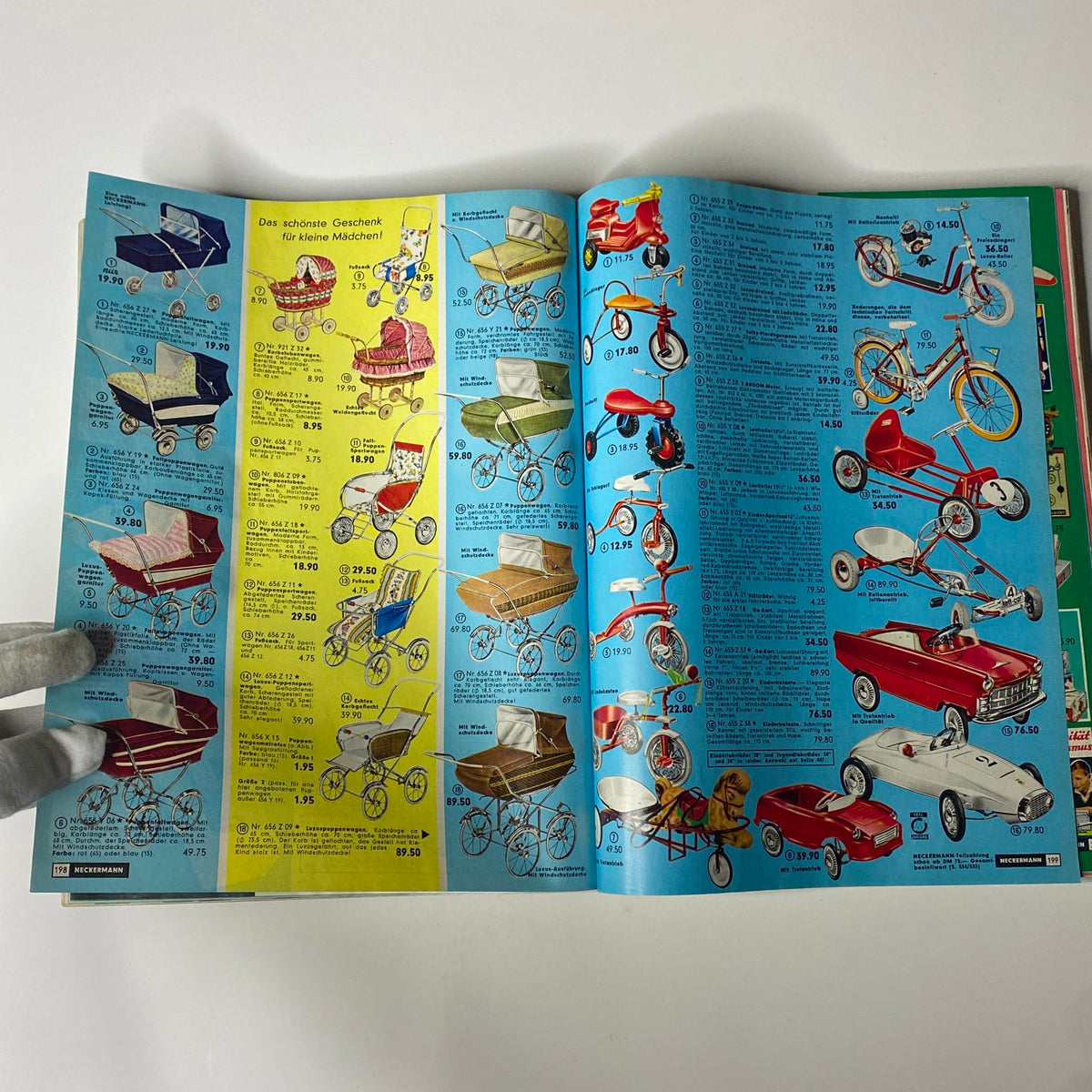 1965-1966 Neckermann Winter Catalog presenting a wide selection of children's strollers and tricycles, illustrating the nostalgic toy designs of the mid-1960s.