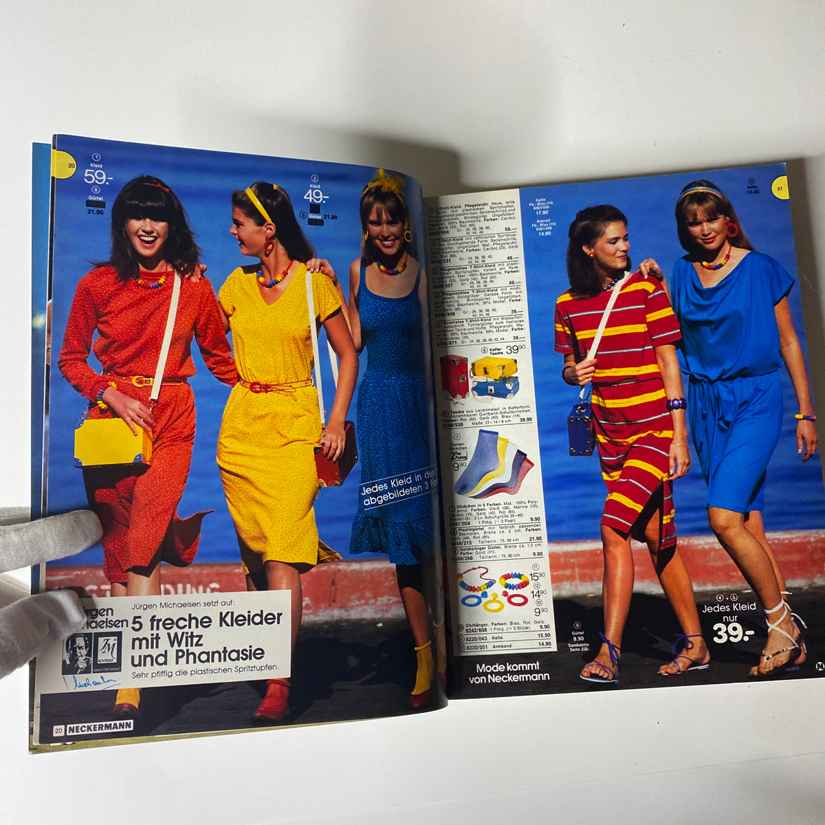 Page from the 1982 Neckermann Summer Catalog illustrating vibrant dresses worn by women, showcasing early 80s fashion styles and accessories.