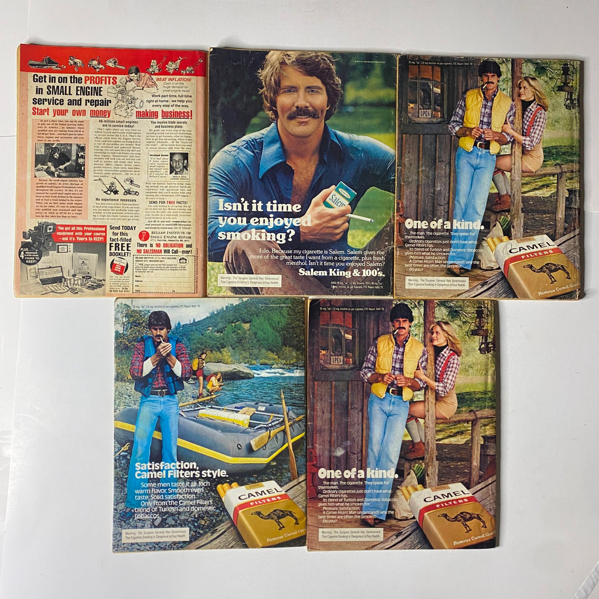 Lot of 5 1970s Front Page Detective Magazine covers featuring sensational true crime tales. Includes ads for Salem and Camel cigarettes, reflecting 1970s advertisement styles alongside compelling magazine content that draws in true crime enthusiasts.