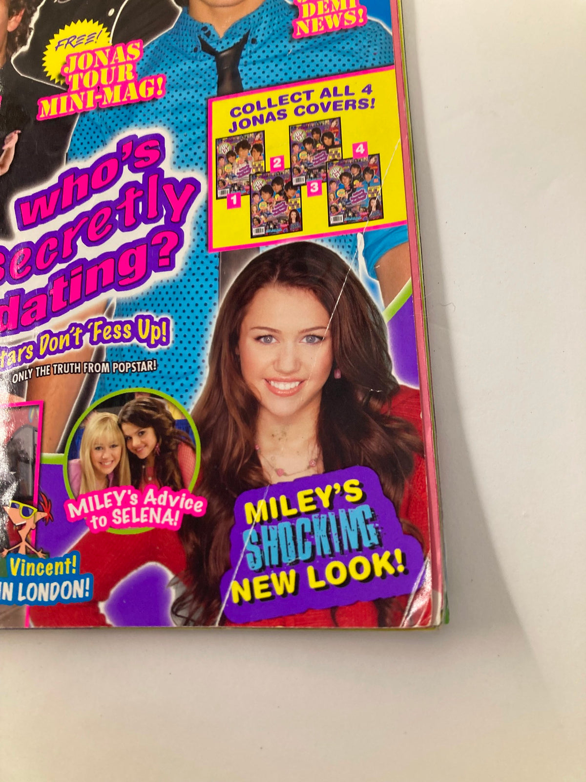 Close-up of Miley Cyrus from the Pop Star Magazine May 2008 cover, featuring her shocking new look alongside text promoting exclusive Jonas Brothers content.