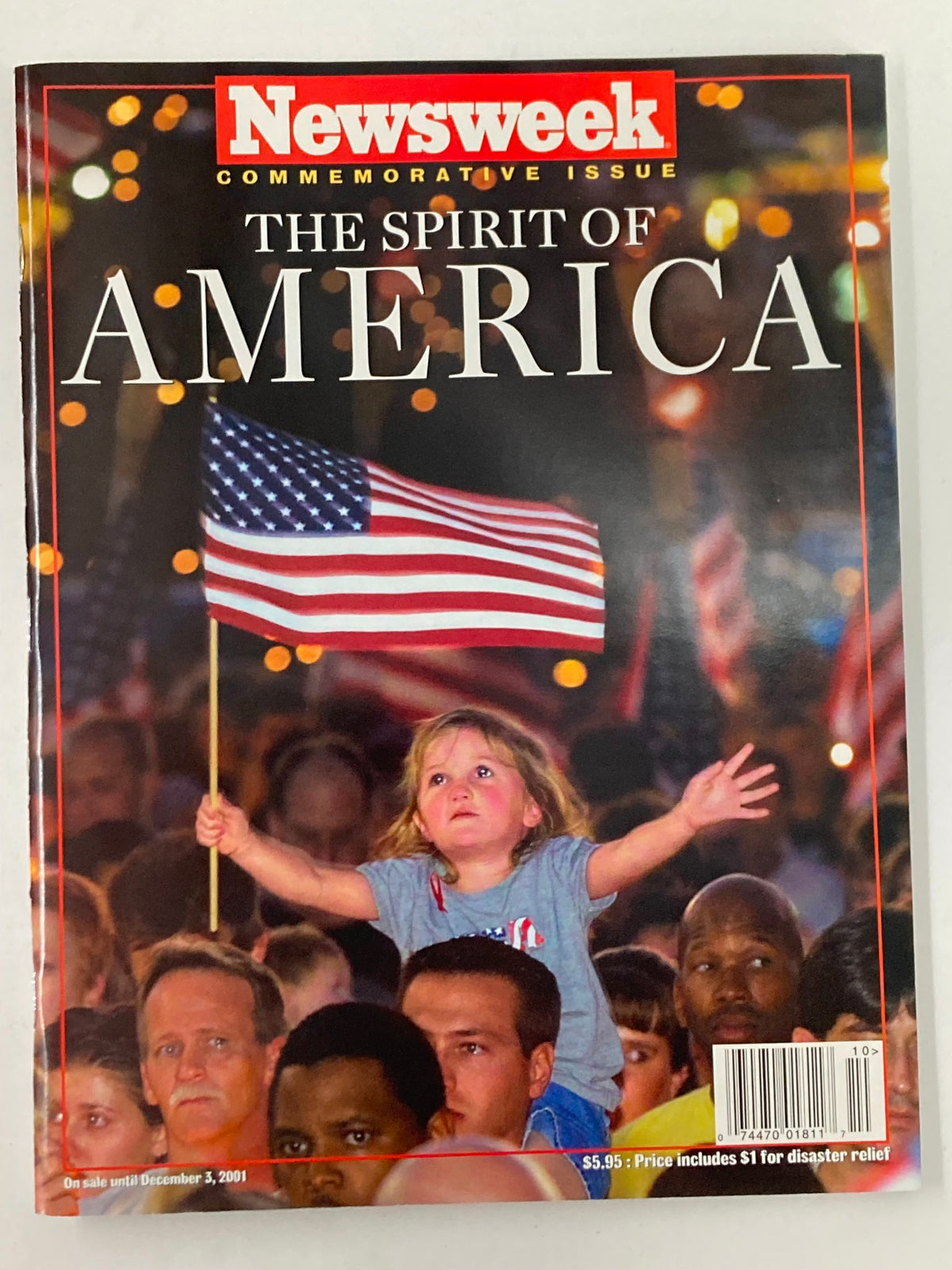 Cover of Newsweek Magazine Fall 2001 The Spirit of America featuring a young girl holding an American flag during a moment of unity.