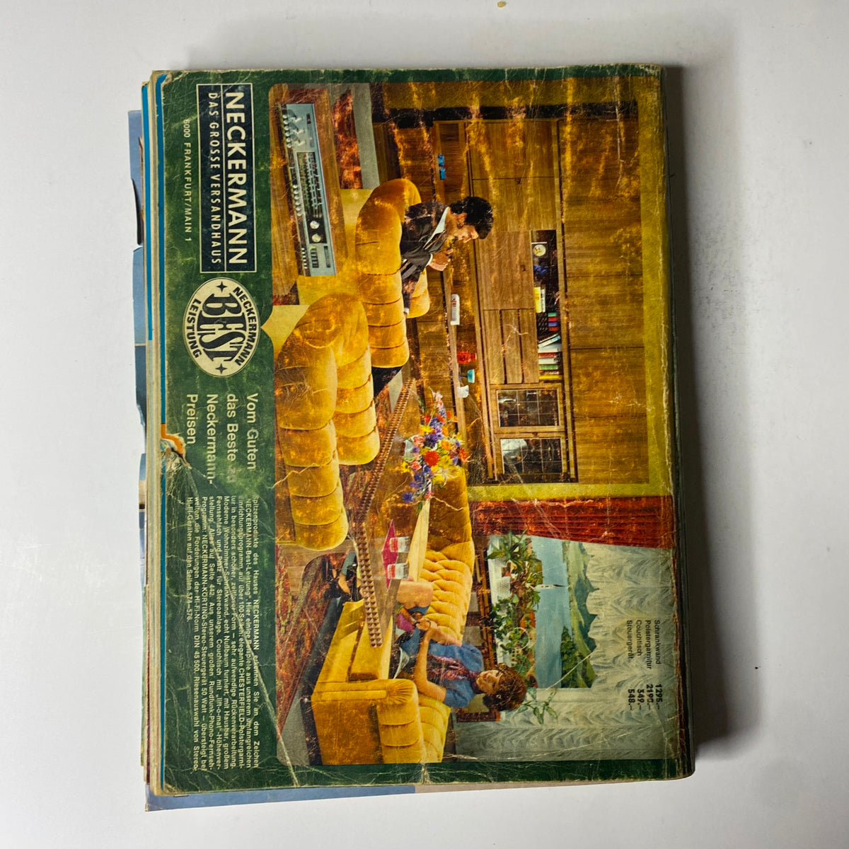 Cover image of the 1973 Neckermann Summer Catalog showcasing vibrant 1970s interior with retro furniture, including a yellow sofa and decorative elements reflecting early-1970s German lifestyle and design.
