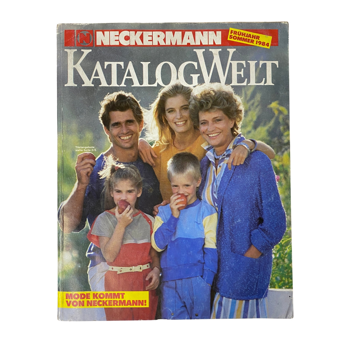 Cover of the 1984 Neckermann Summer Catalog featuring a family of five enjoying outdoor time, each wearing colorful retro outfits. The catalog highlights summer fashion and lifestyle trends from 1980s Germany, making it a unique collector's item.
