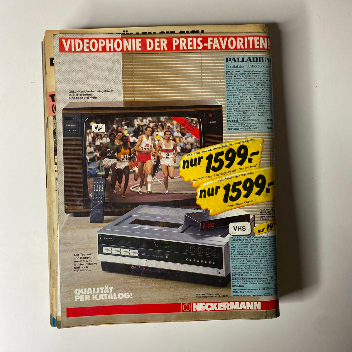 1984 Neckermann Summer Catalog advertising video equipment, including video tape recorders and televisions, representing the entertainment technology of the mid-1980s.