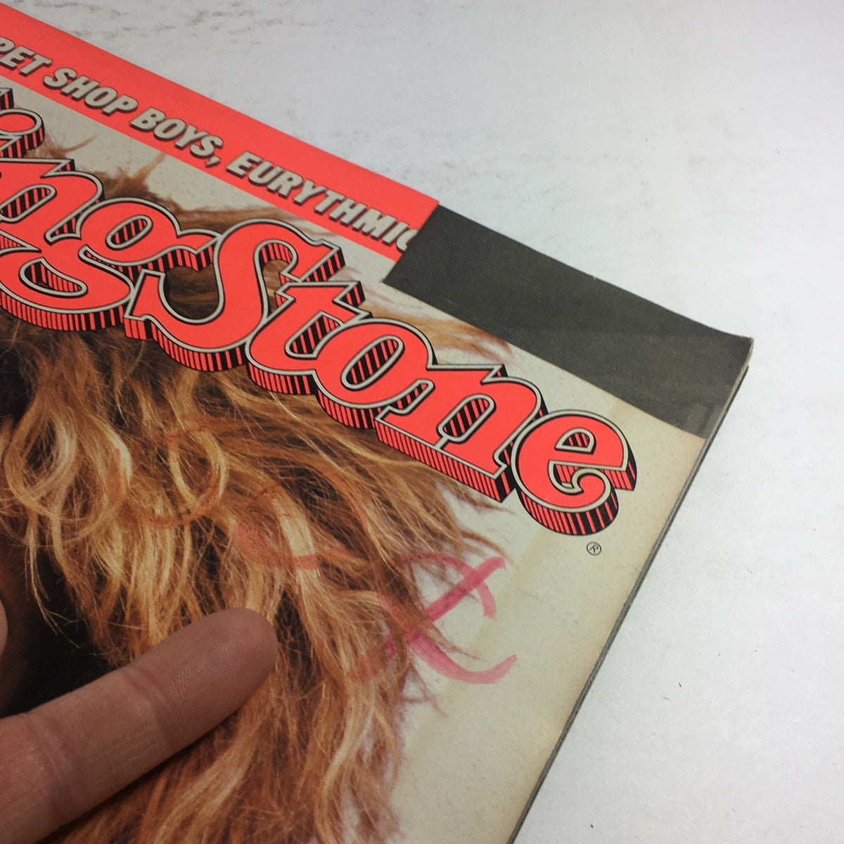 Close-up of the top corner of the Rolling Stone Magazine from October 23 1986 featuring Tina Turner, highlighting the recognizable logo.