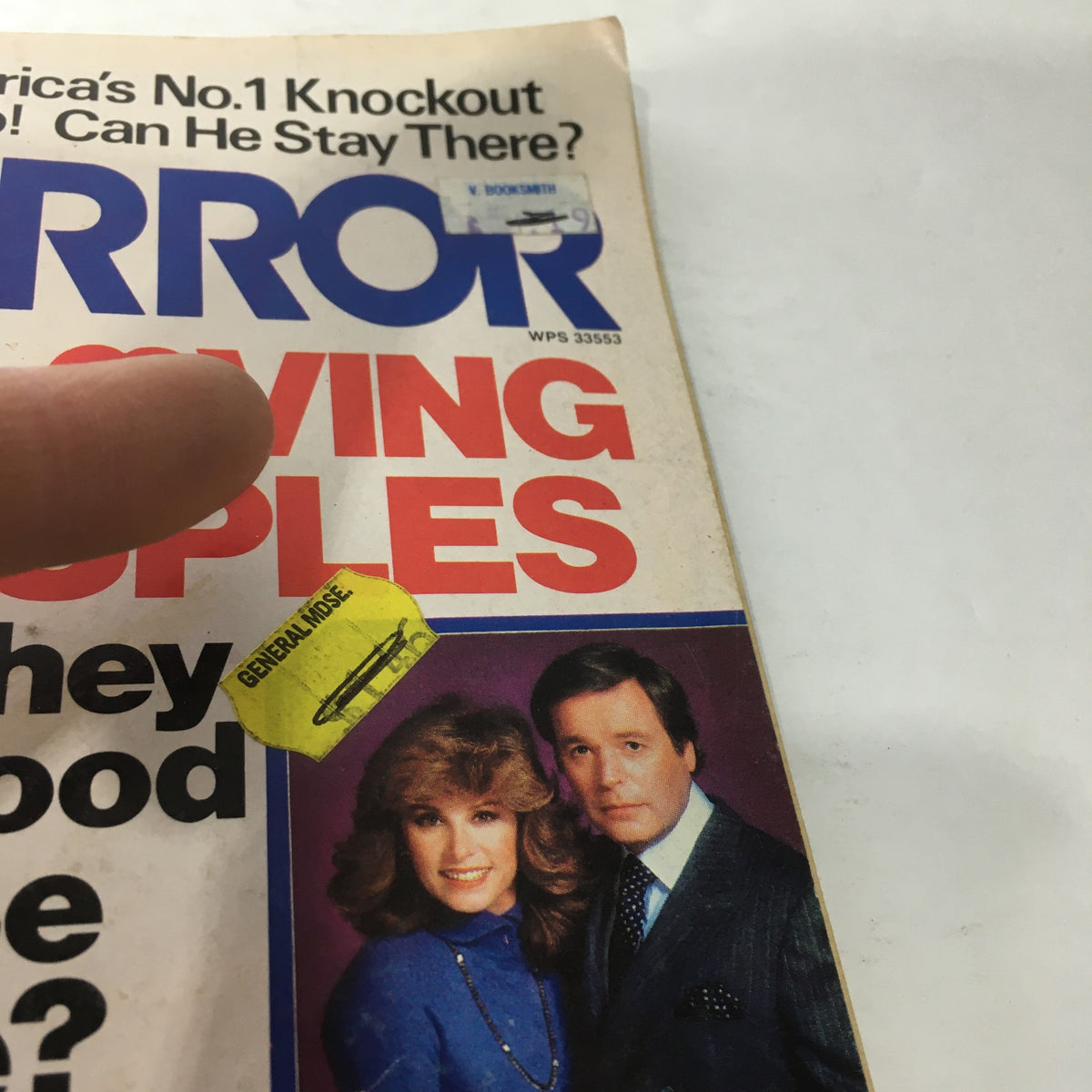Close-up view of the cover of VTG Movie Mirror Magazine from August 1983, focusing on a highlighted section about loving couples. The magazine features iconic television pairs and a notable sticker from General Hospital.