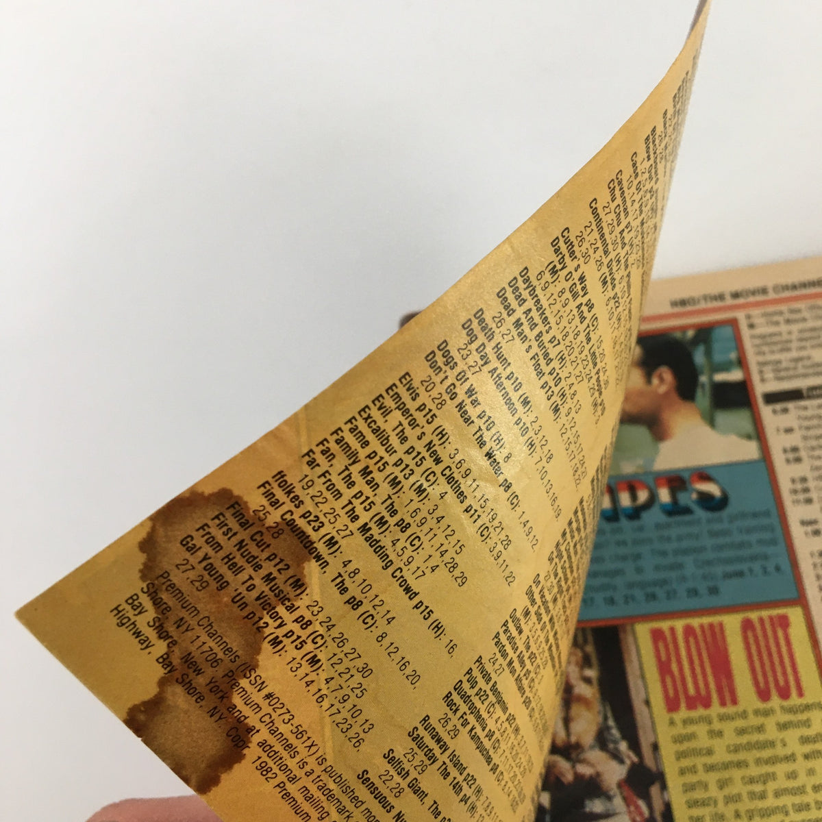 Interior page of VTG Premium Channels Mini Magazine June 1982 showing a list of TV programming, with visible signs of age and water damage.