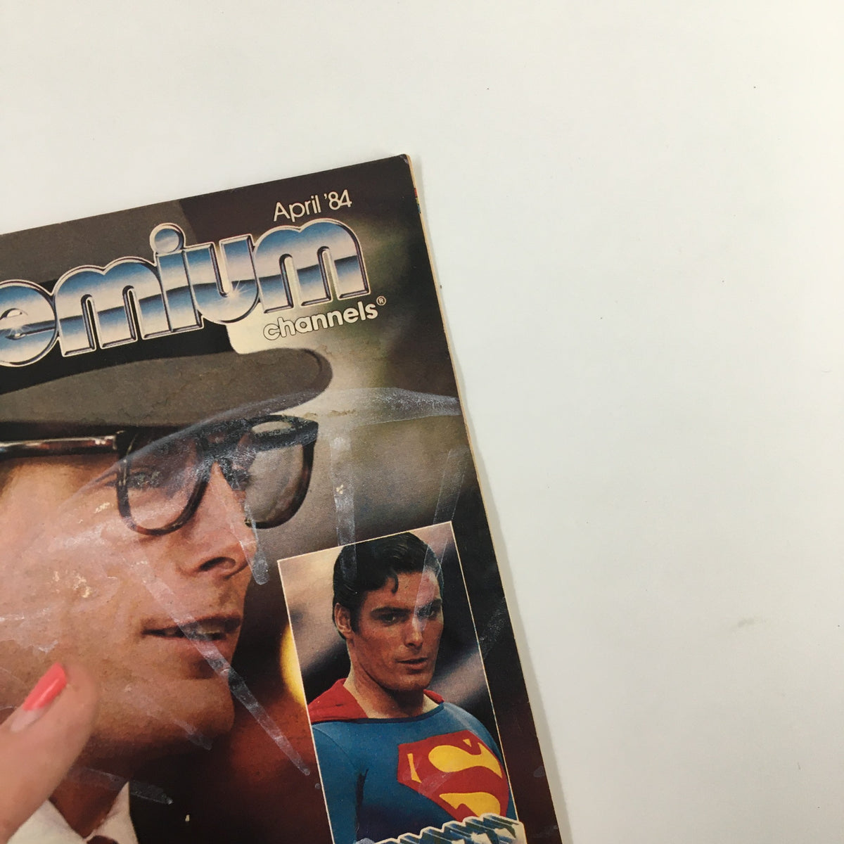 Cover of VTG Premium Channels Mini Magazine April 1984 featuring Christopher Reeve as Superman and an iconic image of Clark Kent, showcasing vintage pop culture.
