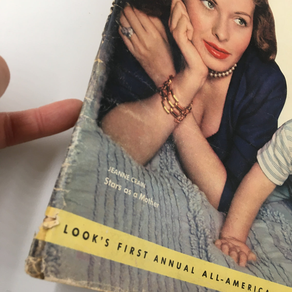 Side view of the VTG Look Magazine from October 10, 1950 displaying Jeanne Crain's portrait with details of the cover, emphasizing vintage glamour with minor wear.