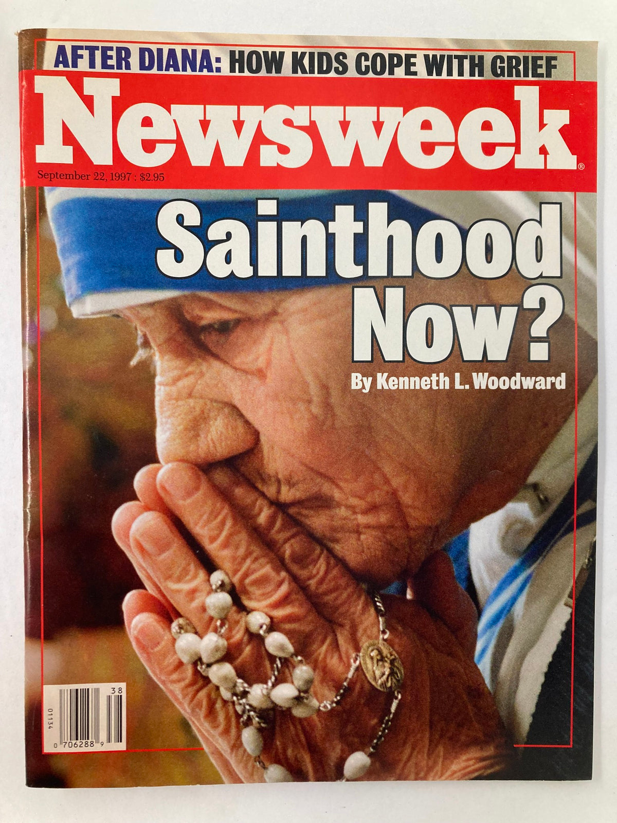 Newsweek Magazine September 22, 1997 cover featuring a close-up of Mother Teresa with her hands clasped in prayer, adorned with a rosary, under the headline 'Sainthood Now?'.