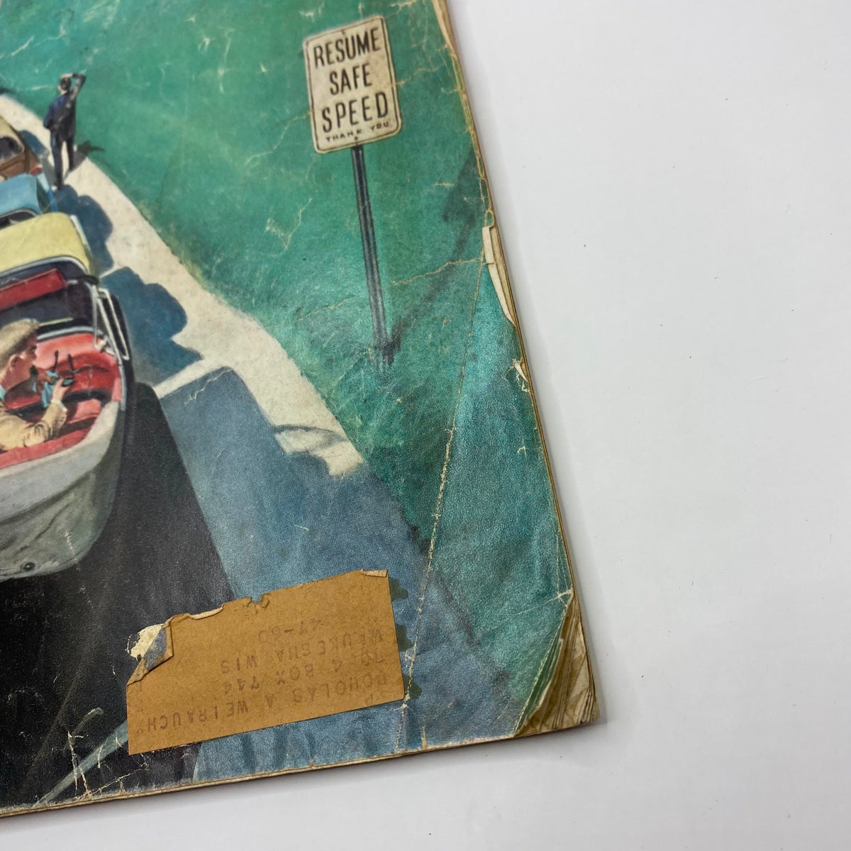Close-up view of the May 30 1959 Saturday Evening Post Magazine cover showing a detail of the sign that reads 'Resume Safe Speed' alongside the artwork.