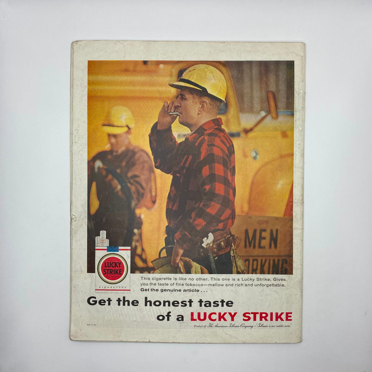 Back cover of Saturday Evening Post Magazine February 28, 1959, featuring a vintage advertisement for Lucky Strike cigarettes, highlighting a worker in a plaid shirt.