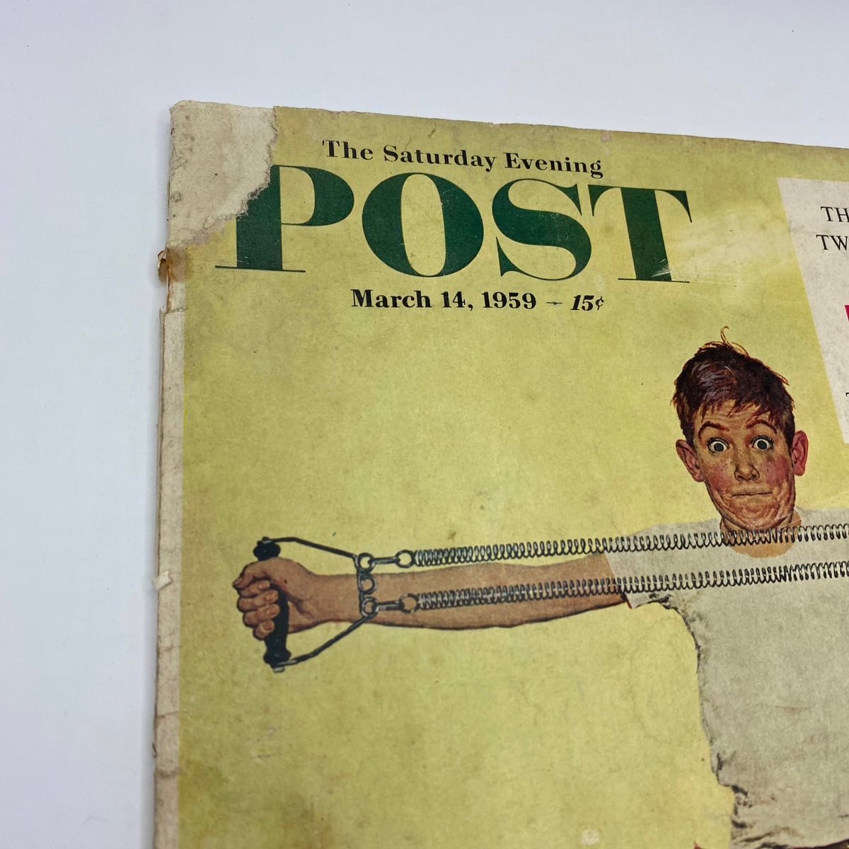 Close-up of the cover of the Saturday Evening Post Magazine dated March 14, 1959, highlighting the boy with a surprised expression pulling on a resistance band, art by Kurt Ard.