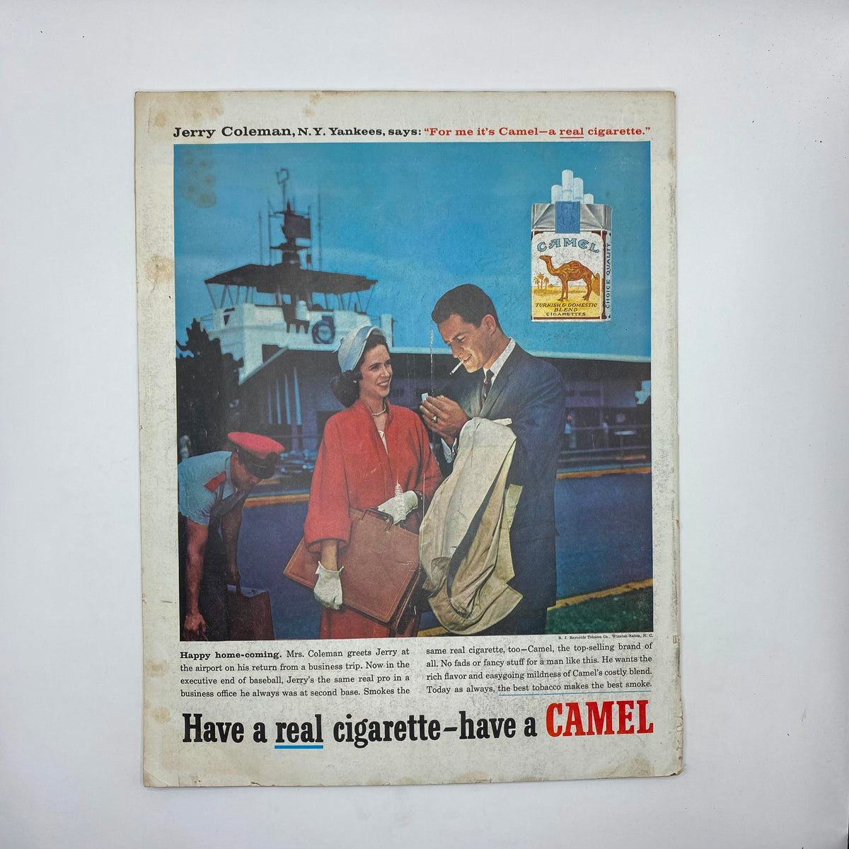 Advertisement page from the Saturday Evening Post Magazine January 3, 1959, showcasing a Camel cigarette ad with a couple at an airport. The image highlights vintage advertising styles and the nostalgic elements of the era.