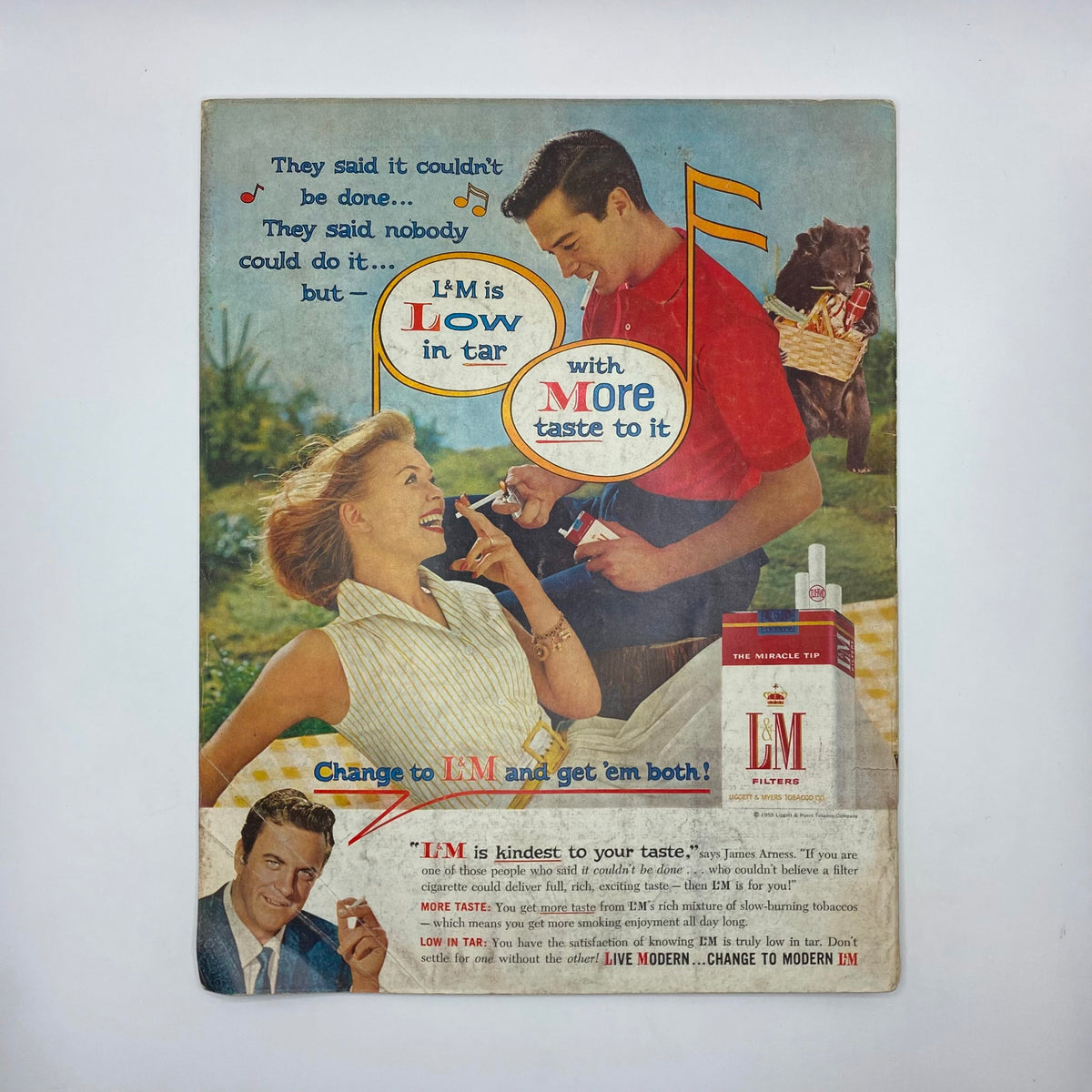 Vintage advertisement from the Saturday Evening Post Magazine October 10, 1959, featuring a cheerful couple enjoying L&M cigarettes, emphasizing the product's low tar and great taste with playful graphics.