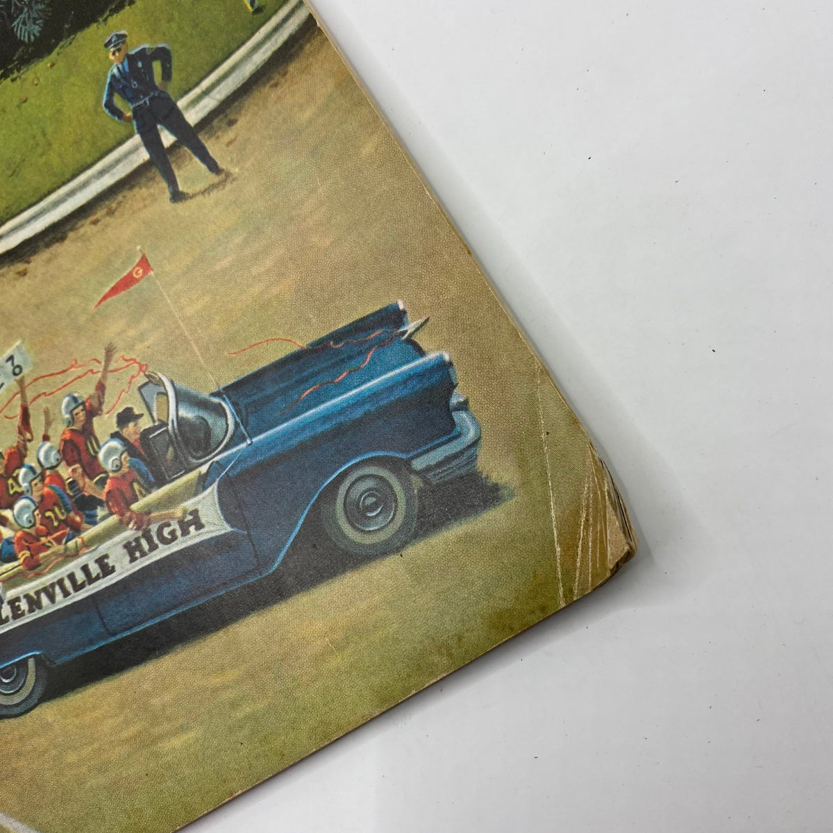 Image of the October 31, 1959, Saturday Evening Post Magazine titled 'Bruisers' featuring a colorful illustration of a high school parade scene with a blue convertible car at Glenville High. This vintage collectible showcases mid-century artwork.