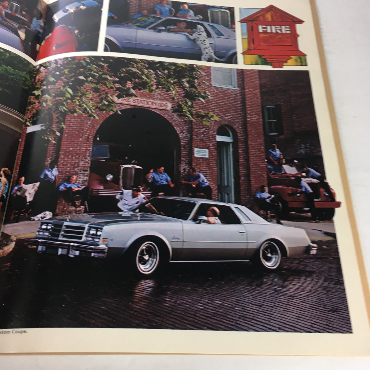 1977 Buick Buyer's Guide showcasing a silver Electra parked in front of a vintage fire station with people interacting nearby.