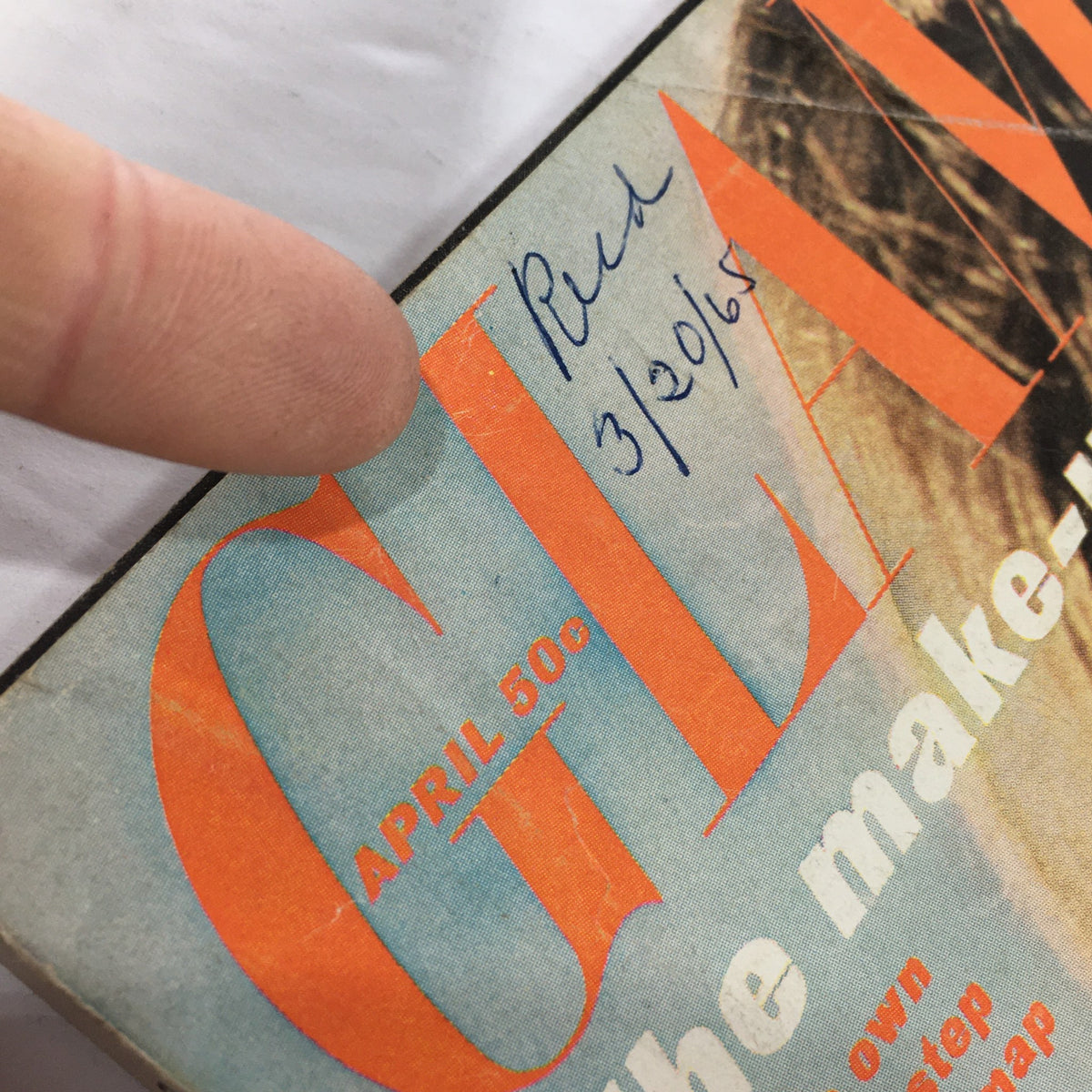 Close-up of the VTG Glamour Magazine April 1965 cover date and handwritten note indicating the date '3/20/65', highlighting vintage details.
