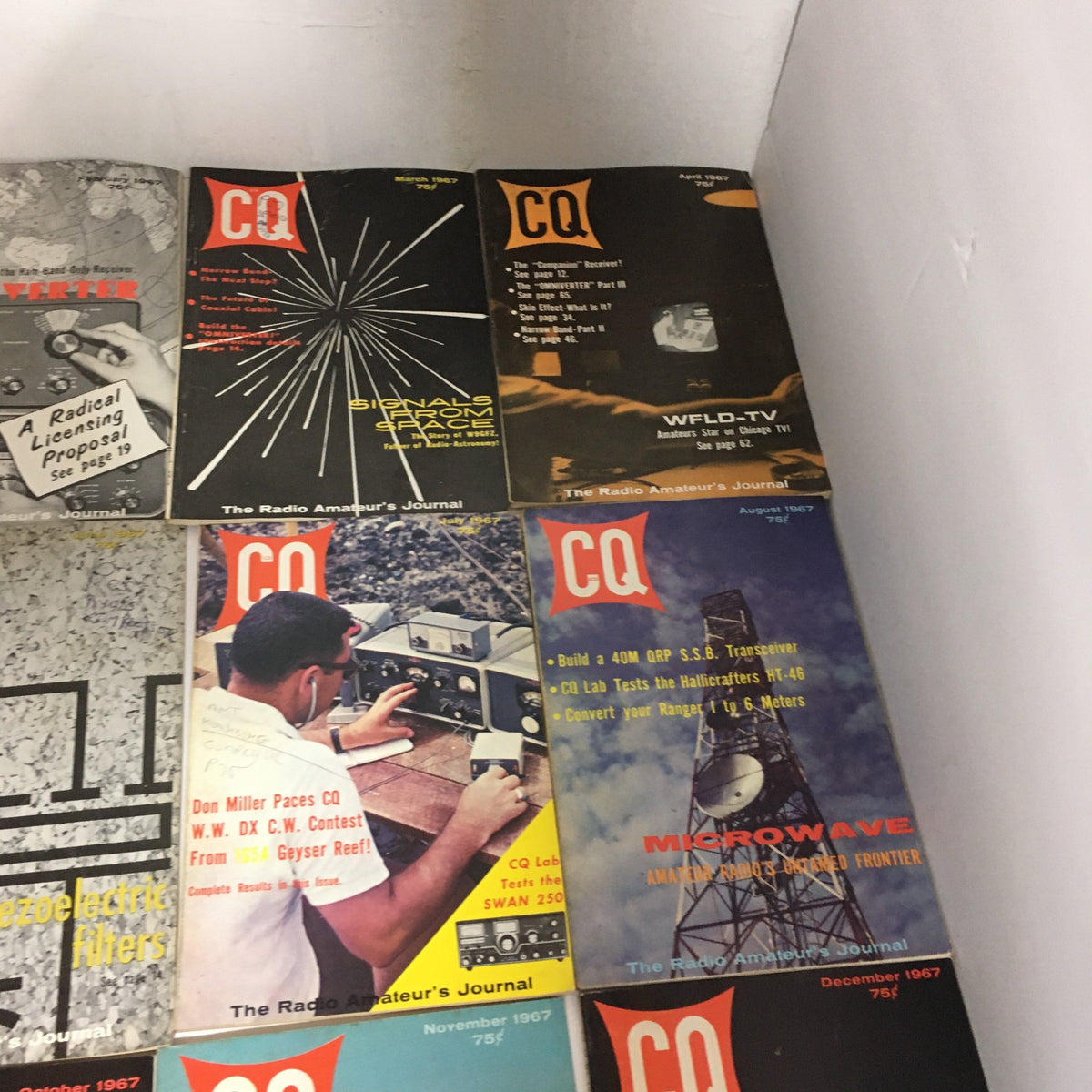 Lot of 12 Complete January to December 1967 CQ The Radio Amateur's Journal displaying vibrant magazine covers, including insights into amateur radio technology and culture.
