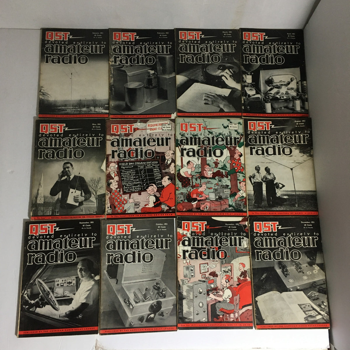 Lot of 12 Complete January to December 1951 QST Amateur Radio magazines showcasing vintage covers, featuring various themes related to amateur radio operations and technology from 1951.