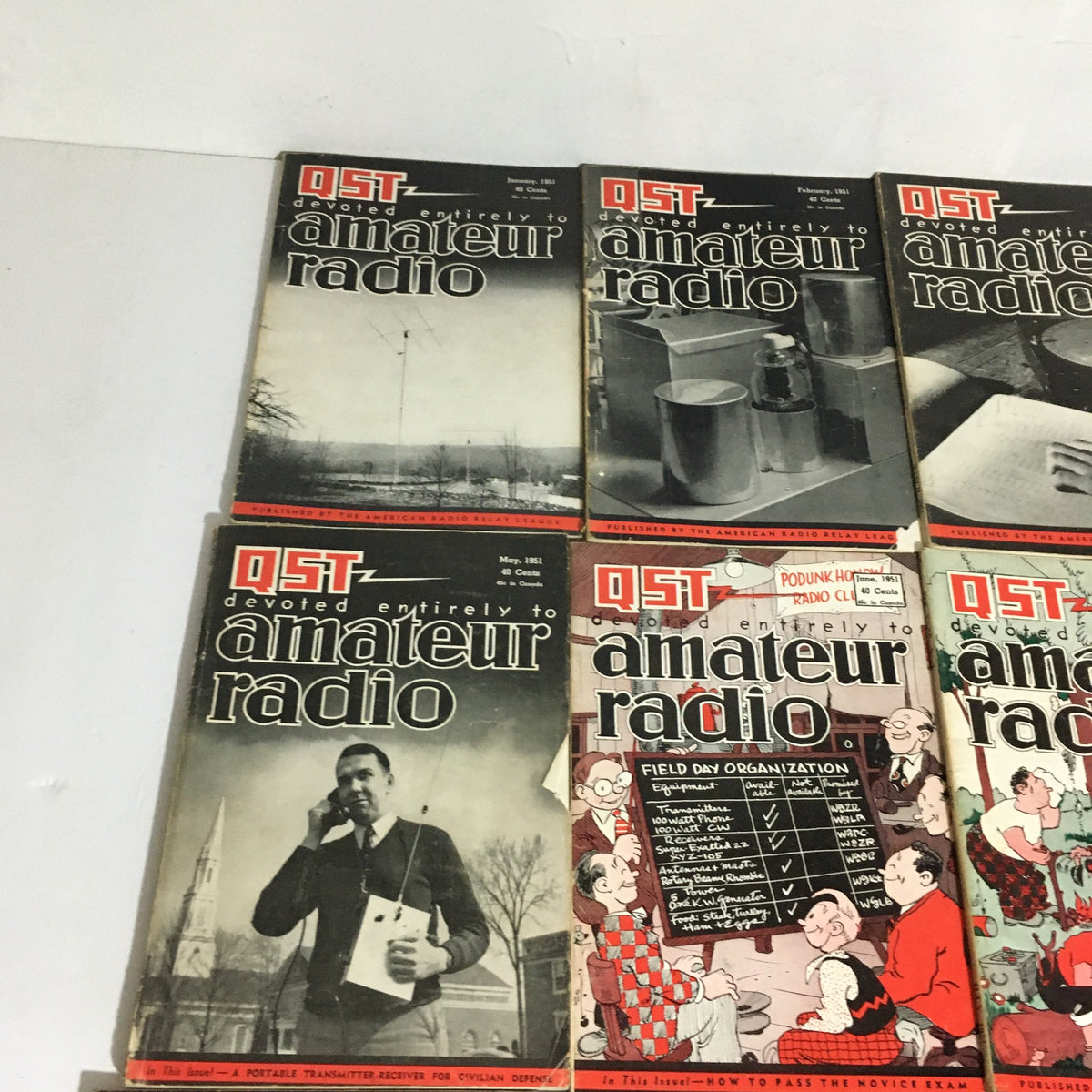 Lot of 12 Complete January to December 1951 QST Amateur Radio magazines showcasing covers with various illustrations and photographs related to amateur radio.
