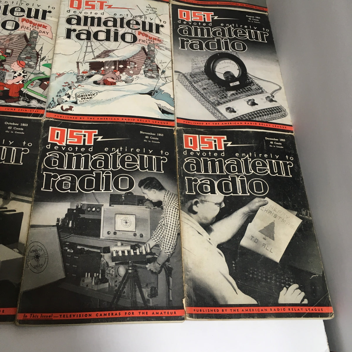 Lot of 12 Complete January to December 1953 QST Amateur Radio magazines featuring covers from October to December 1953.