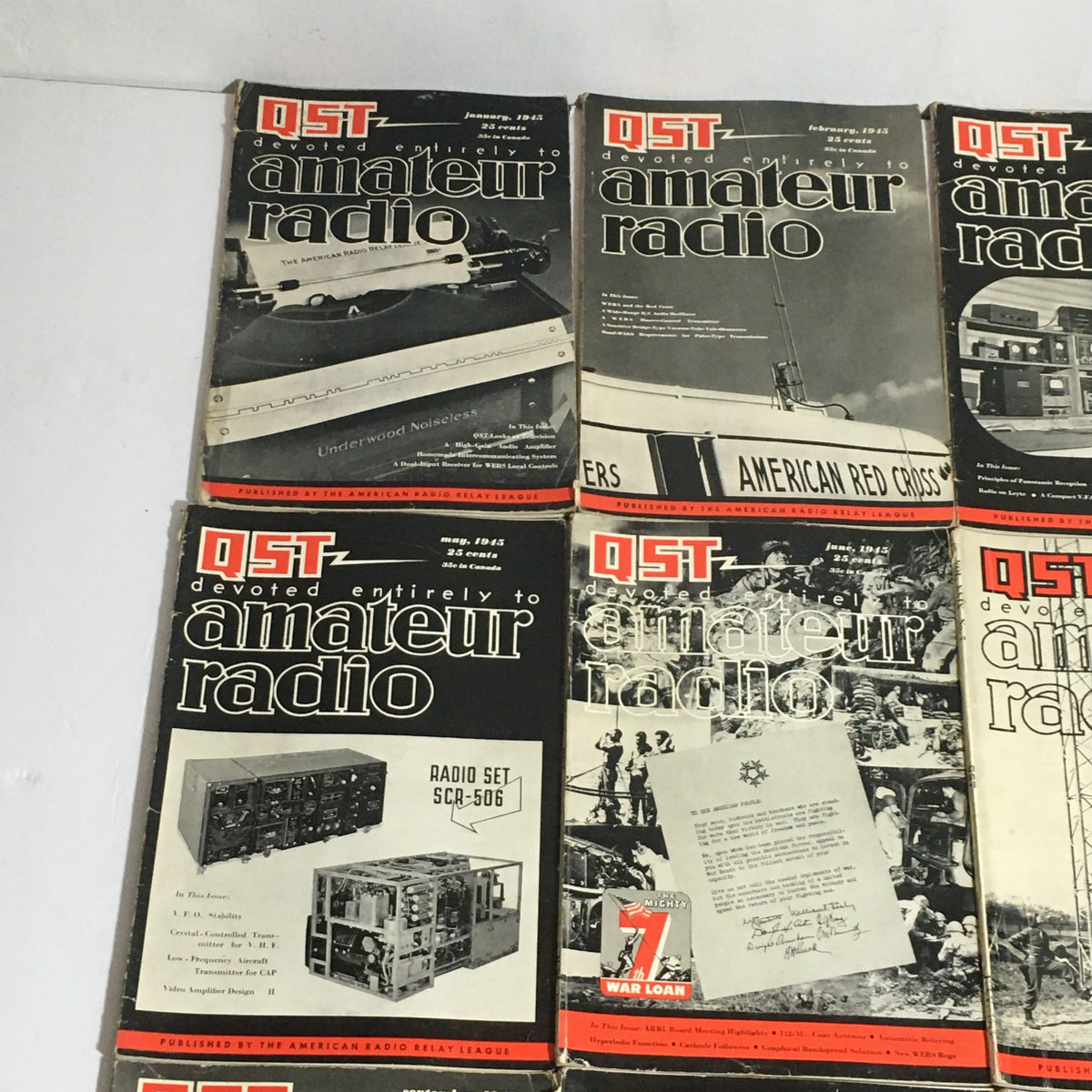 Lot of 12 Complete January to December 1945 QST Amateur Radio magazines featuring titles and graphics relevant to amateur radio technology.