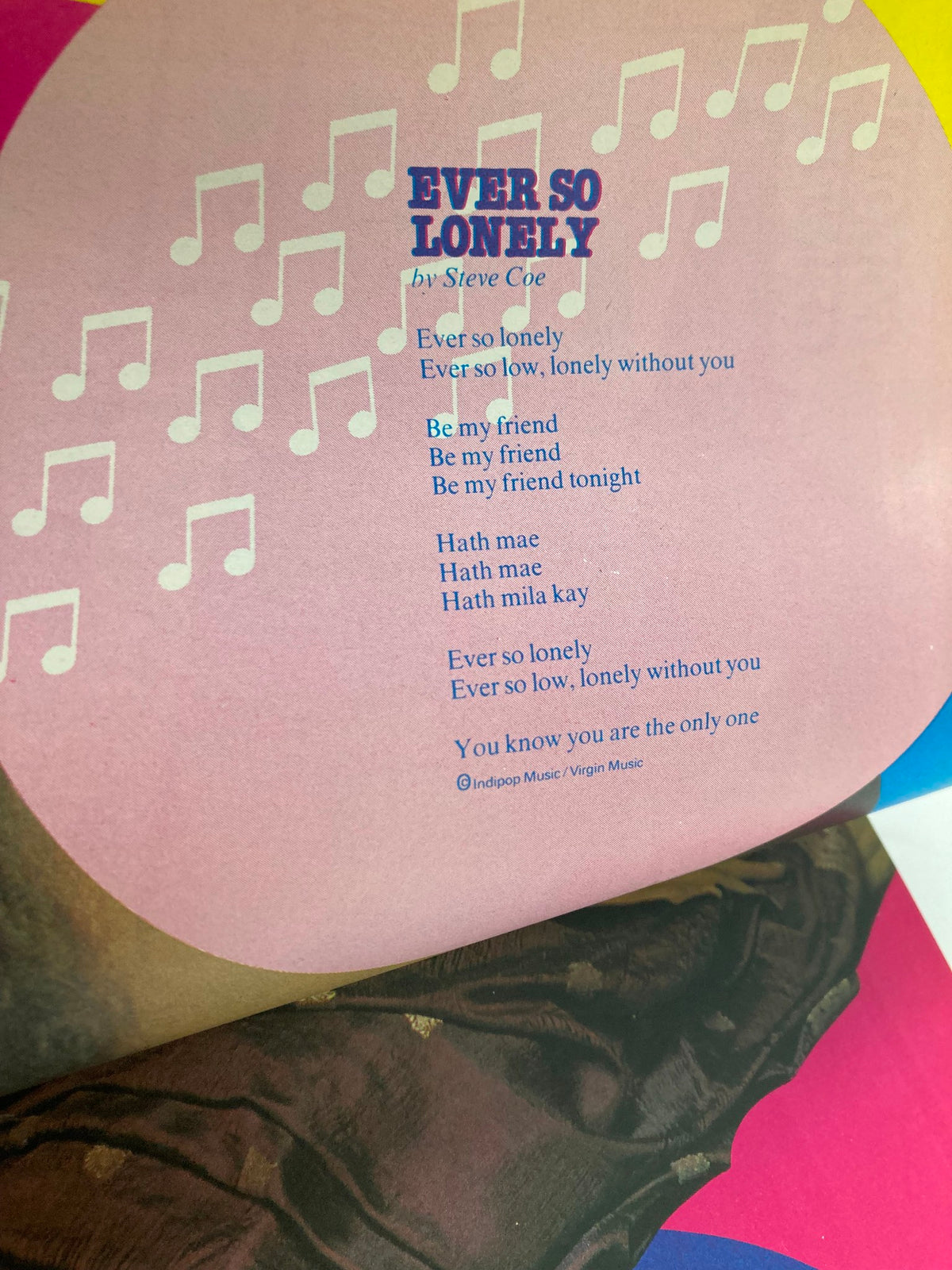 Interior page from the VTG Lookin Magazine May 29, 1982, displaying the song lyrics to 'Ever So Lonely' by Steve Coe. The page features a background with musical notes and a colorful design, illustrating the magazine's musical focus and pop culture themes.