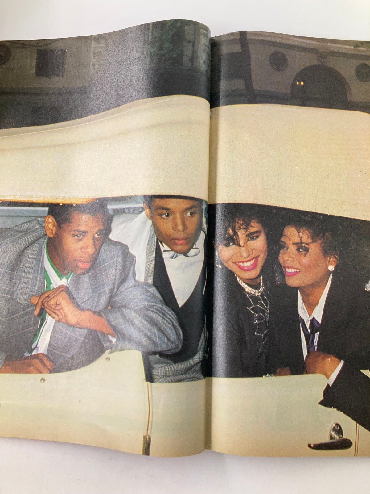 Image from VTG Lookin Magazine September 5 1987, featuring a group of stylish individuals in a car, capturing the vibrant fashion and social culture of the late 1980s.