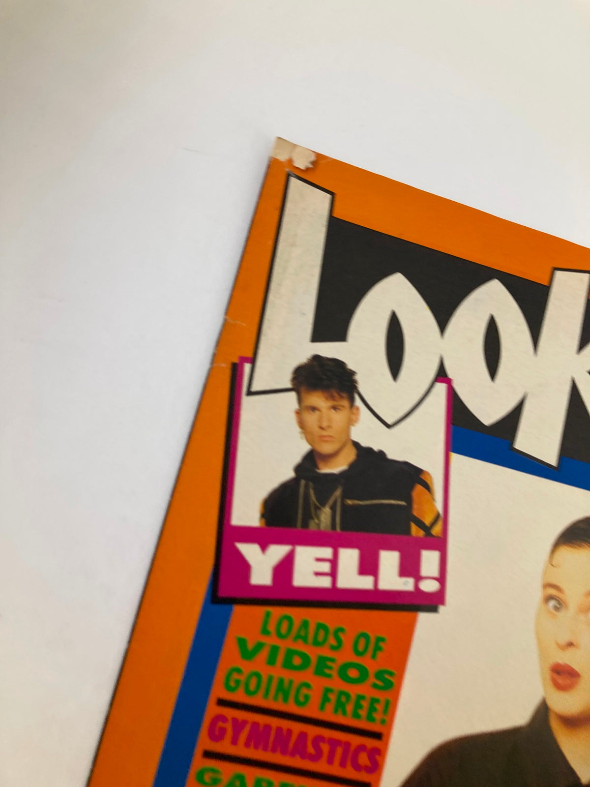 Close-up of Lookin Magazine's cover showing the corner with Yell! featured and a photo of Lisa Stansfield, highlighting retro graphics and vibrant colors.